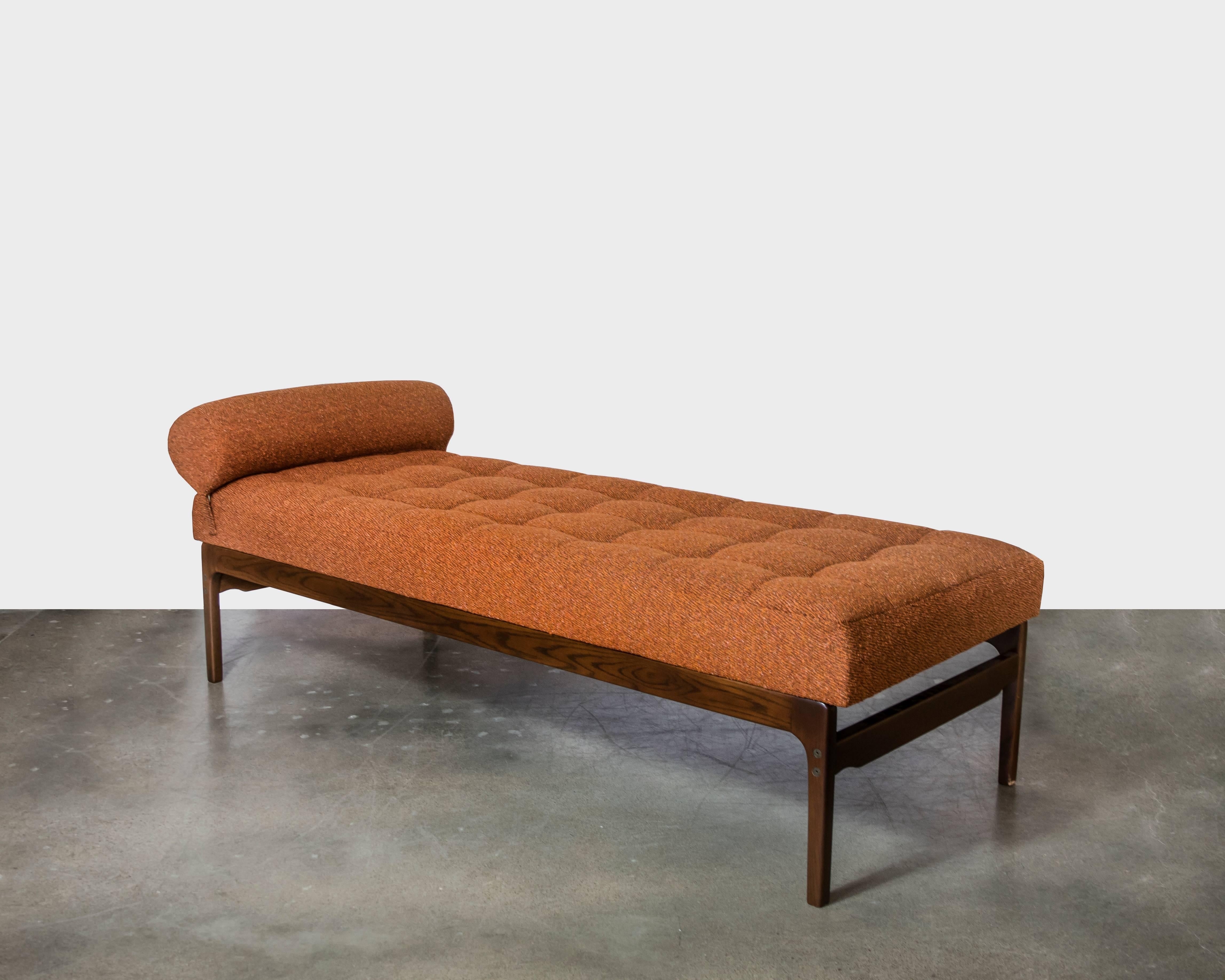 If you don't have the budget or space for the Barcelona sofa by Mies van der Rohe, this knockout bench or chaise longue is a wonderful substitute. Covered in newer orange and brown chenille with a walnut base in excellent vintage condition.