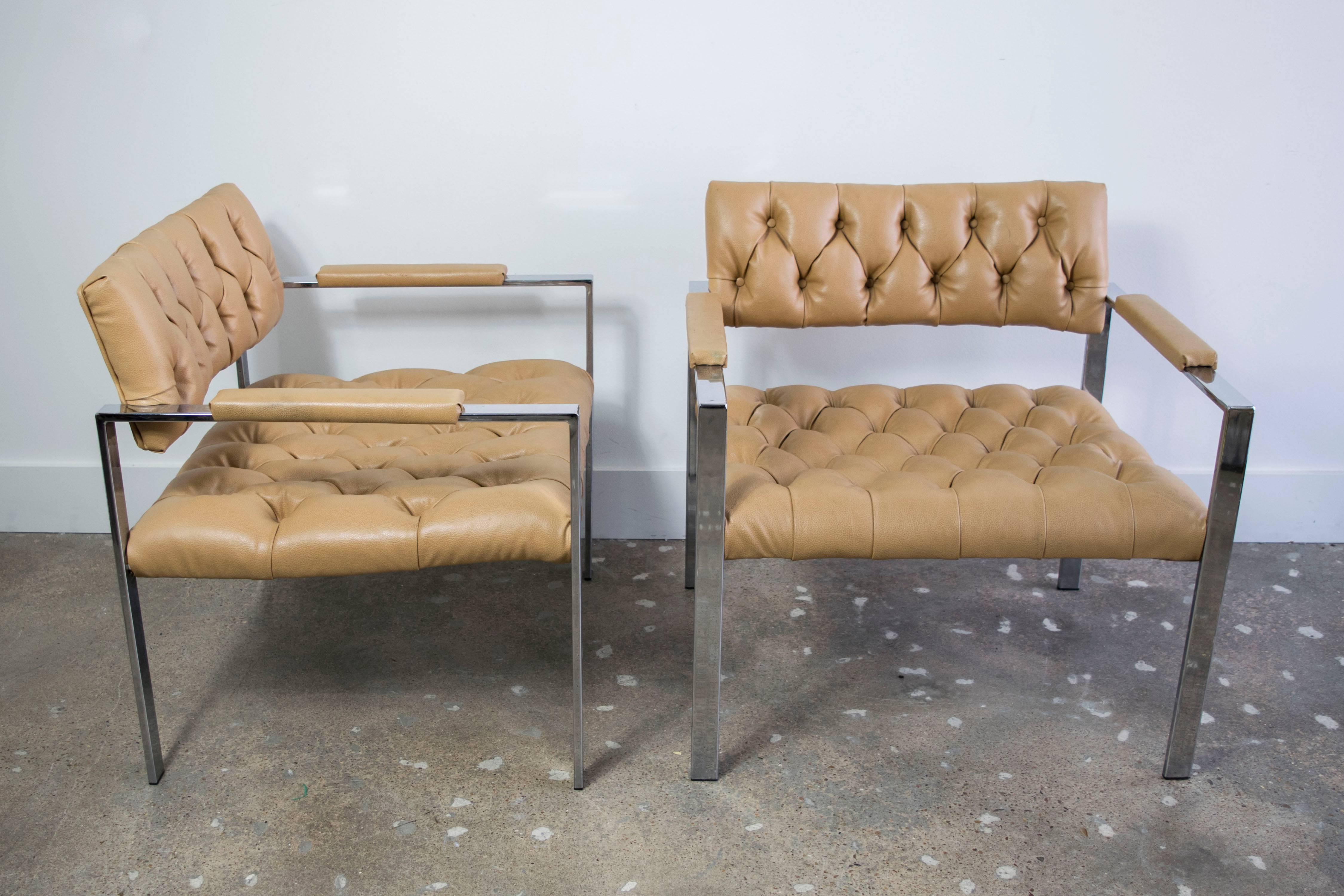 Rare pair of flat bar tufted arm chairs in the style of Harvey Probber in their original vinyl (leather?).