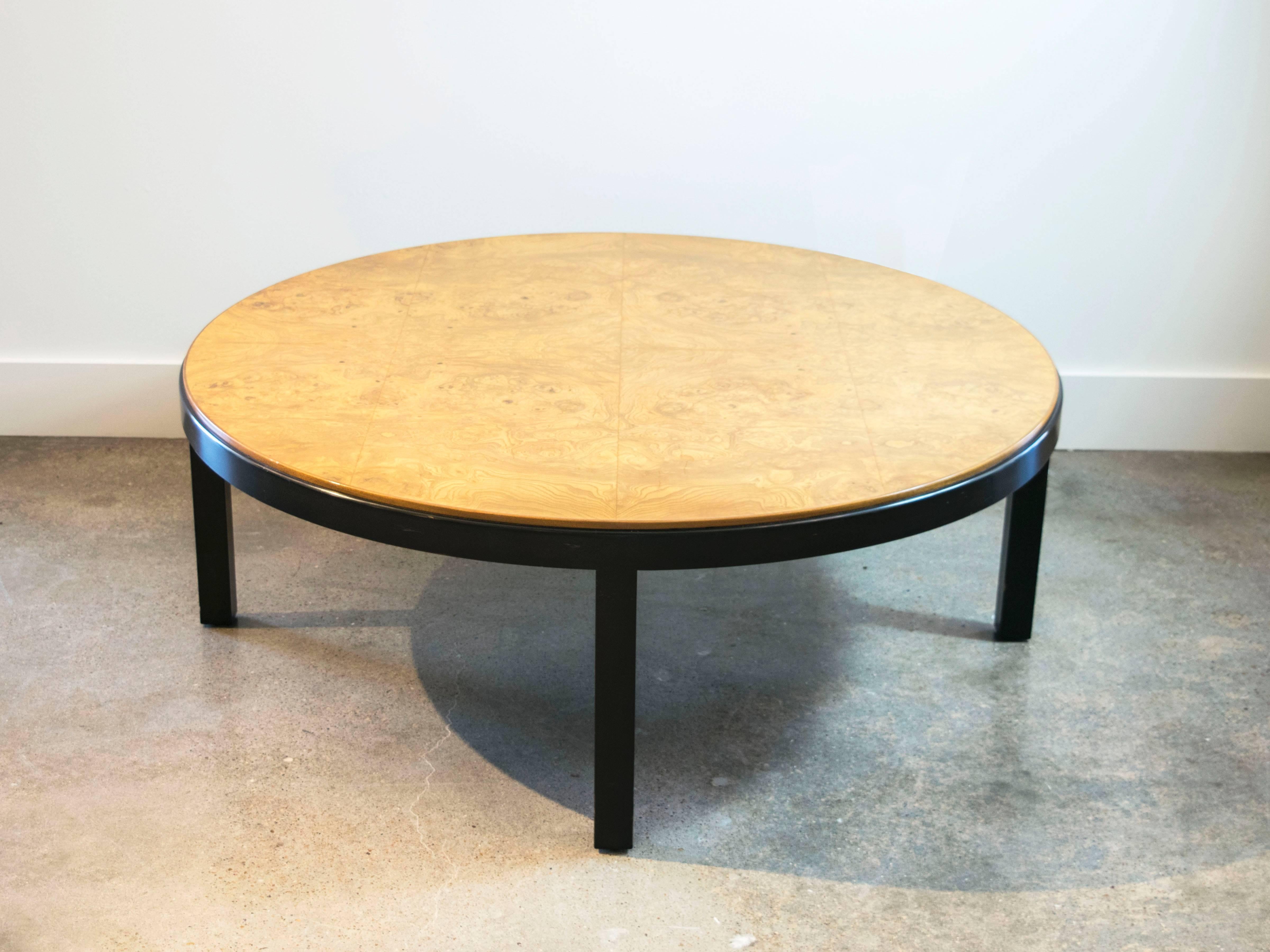 This tabletop has a beautiful book matched burl graining with a very rich pattern and is inset into an ebonized base (Directional tag underneath).