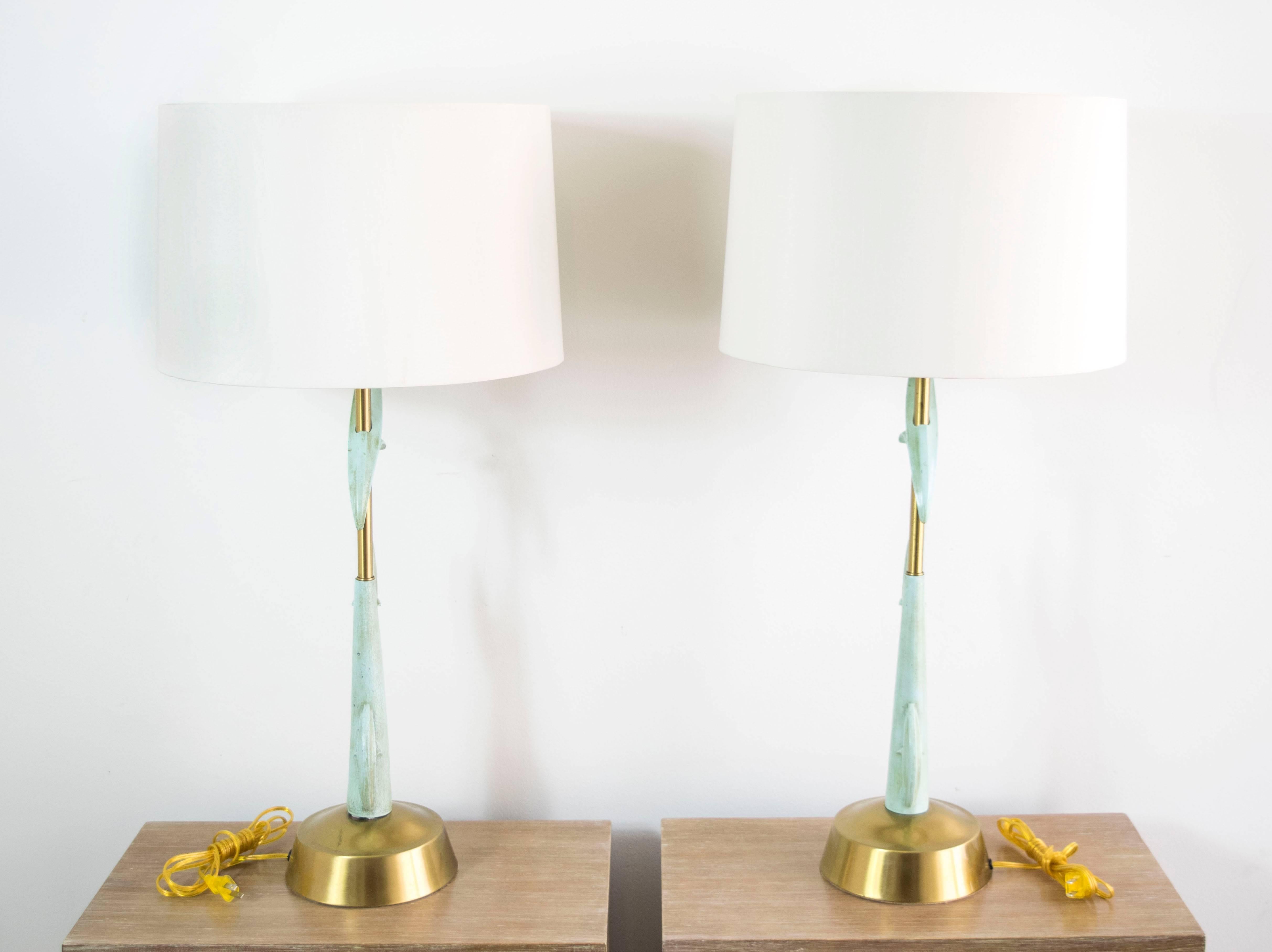 Elegant and tall brass and enamel metal lamps by Rembrandt.