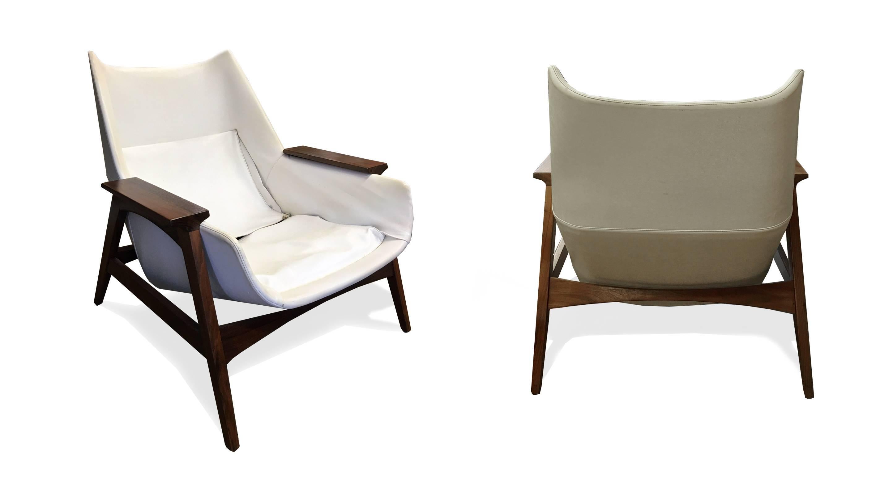 Mid-Century Modern Pair of Mid-Century arm chairs and ottoman, in the style of Ico Parisi