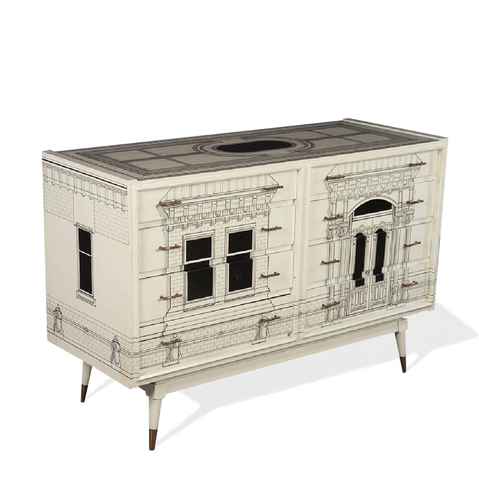 Fornasetti style commode having eight drawers with neoclassical inspired architectural building façade decorated front, top and sides. Raised on tapering legs.