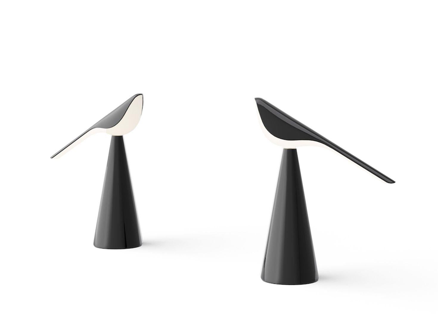 Nao Tamura’s characterful, bird-inspired lamp is cast from milky-white polycarbonate, creating a delicate form. Designed to sit in clusters or ‘flocks’, the Tiki portable lamp features a battery-powered LED and a magnetic charging base for a