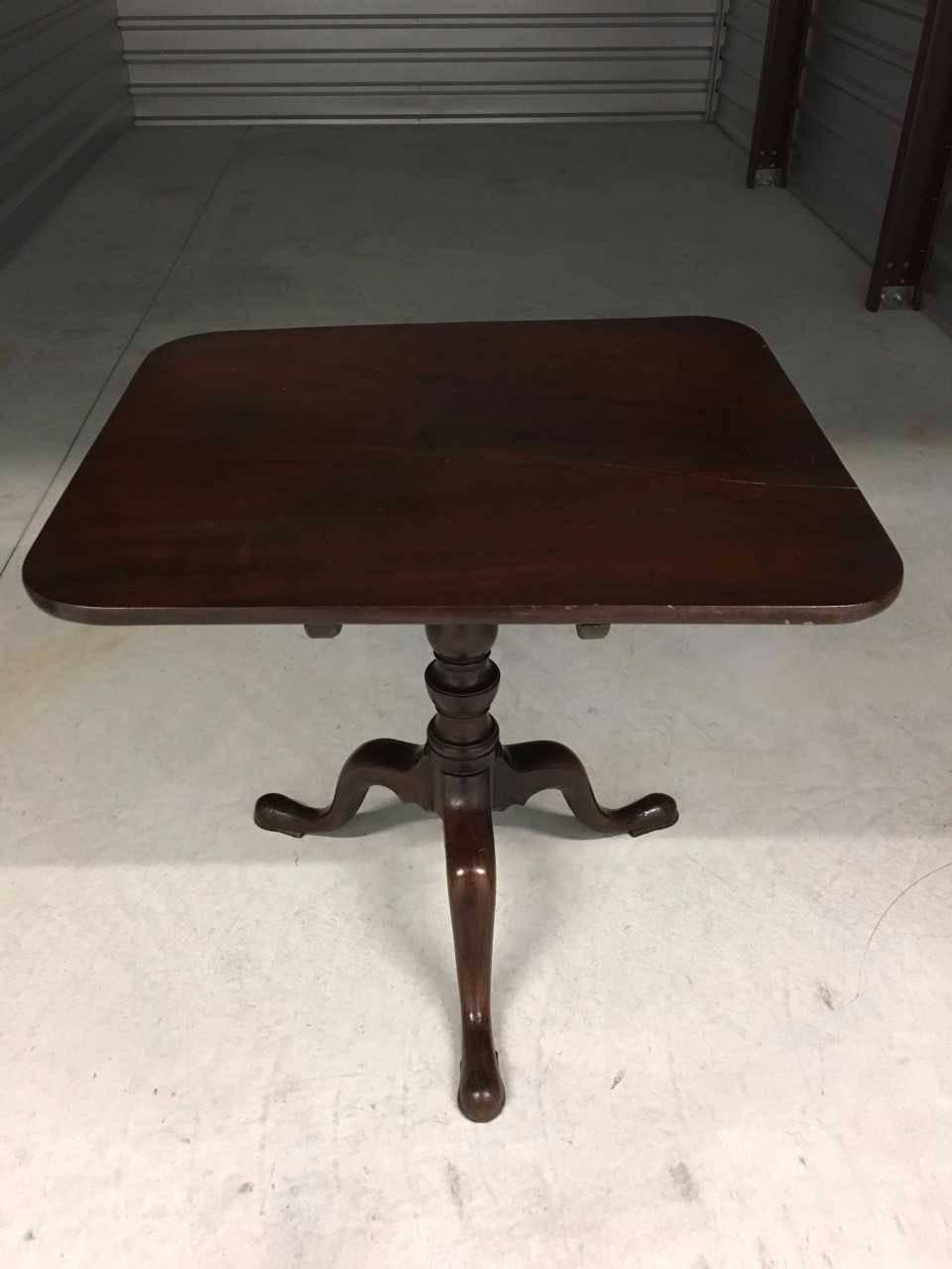 Georgian mahogany tilt-top table, rectangular top above cabriole legs and pad feet, 19th century England.

Table can be utilized as a game table, end table or luncheon/ tea table. 

       