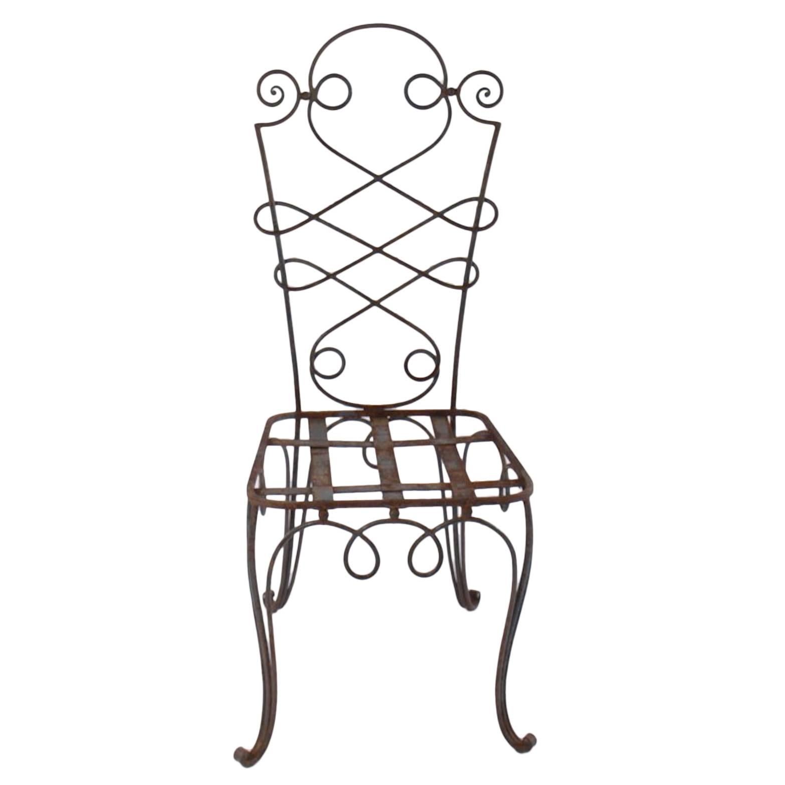 René Prou iron chairs, France, c. 1940. Eight (8) chairs available, sold individually. *Chairs require seat cushions.
