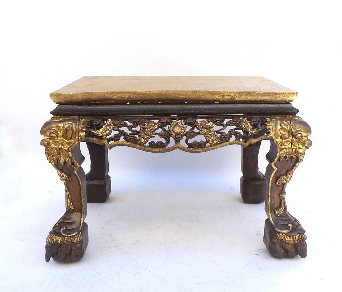 A 19th century parcel-gilt Chinese export coffee table with pierced carved apron. 

Dimensions: 27