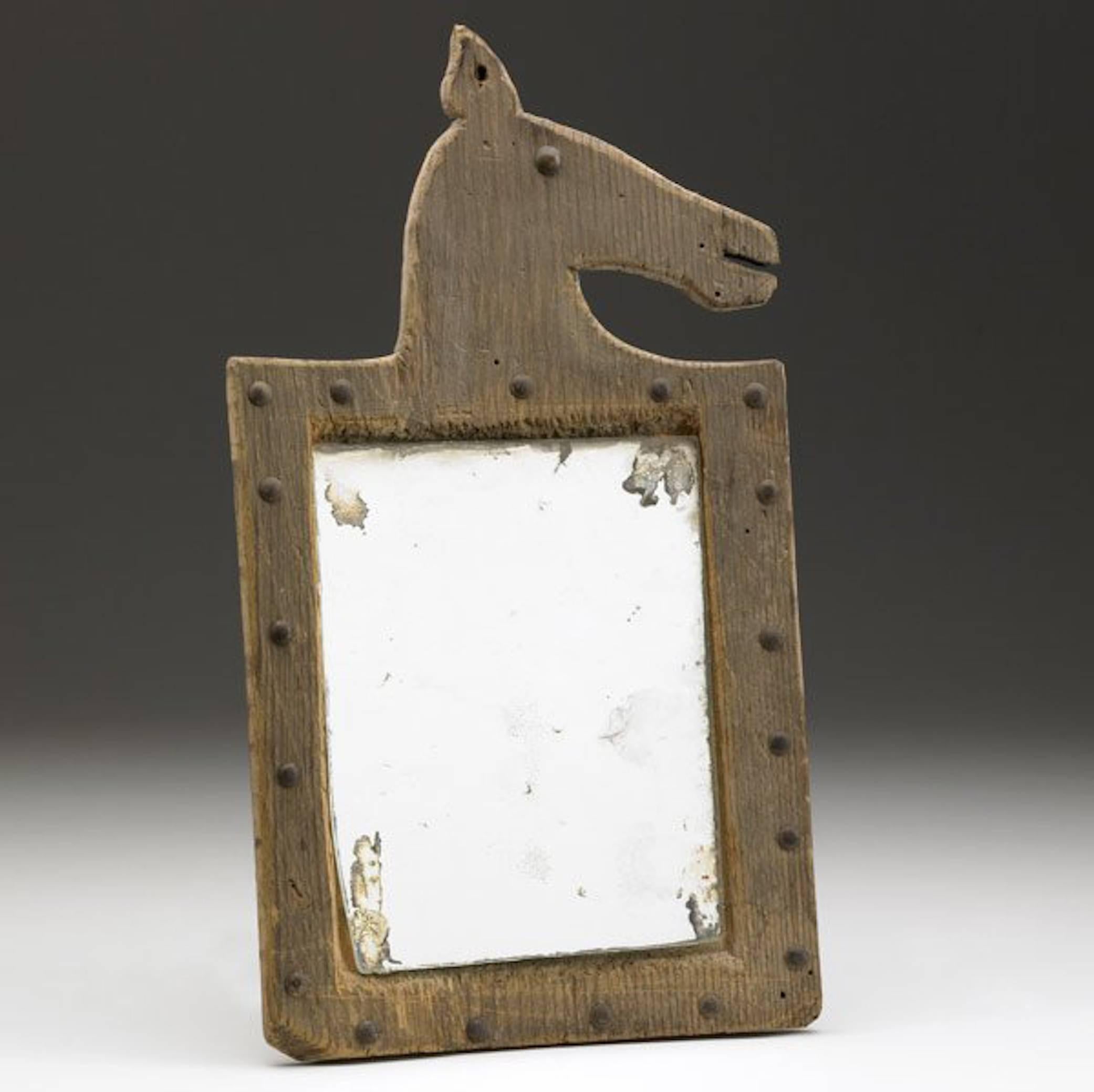 Folk Art "horse effigy mirror" by American artist, Alan Kessler, 1987; inspired by American Indian effigy art pieces. 

Provenance: 
Rago Auctions, Owners: Miriam Tucker, David Rago
Date(s) Sold by Rago Auctions: 
-April 25, 2014; Lot 493