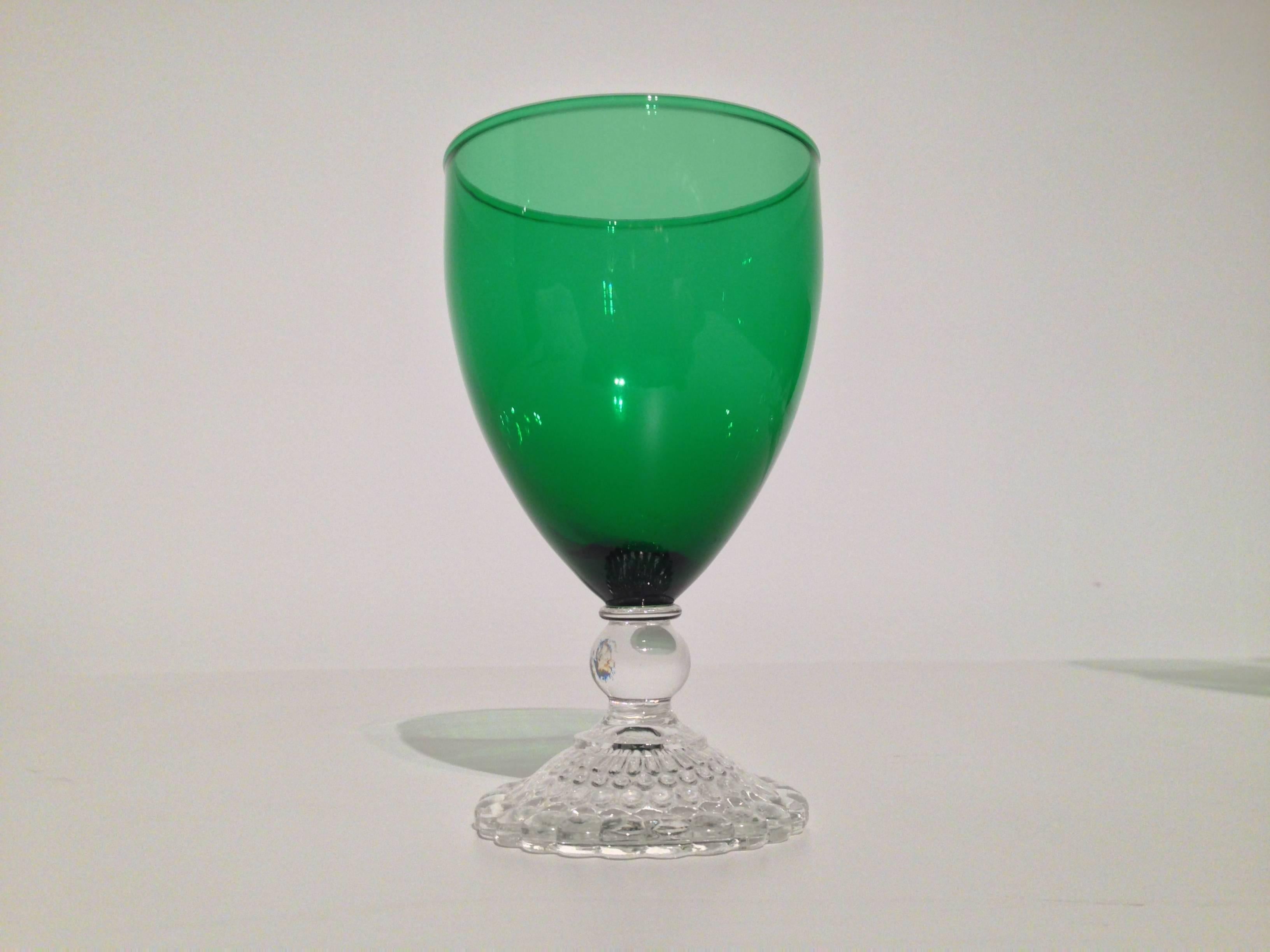 A set of six emerald green Anchor Hocking water goblets with bubble-form clear glass feet, circa 1940.