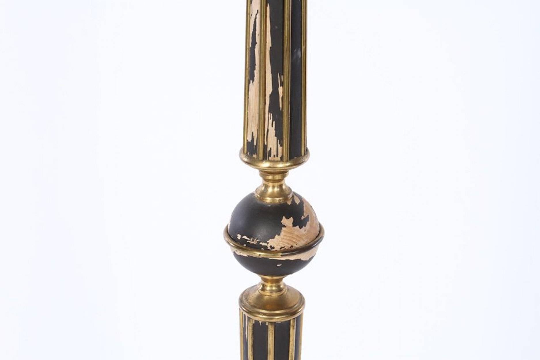 Gilbert Poillerat (attributed) 
France, 1945

Floor lamp; black painted wood standard with brass inlay; resting on four legs of brass and iron. 

Dimensions: H 61.5