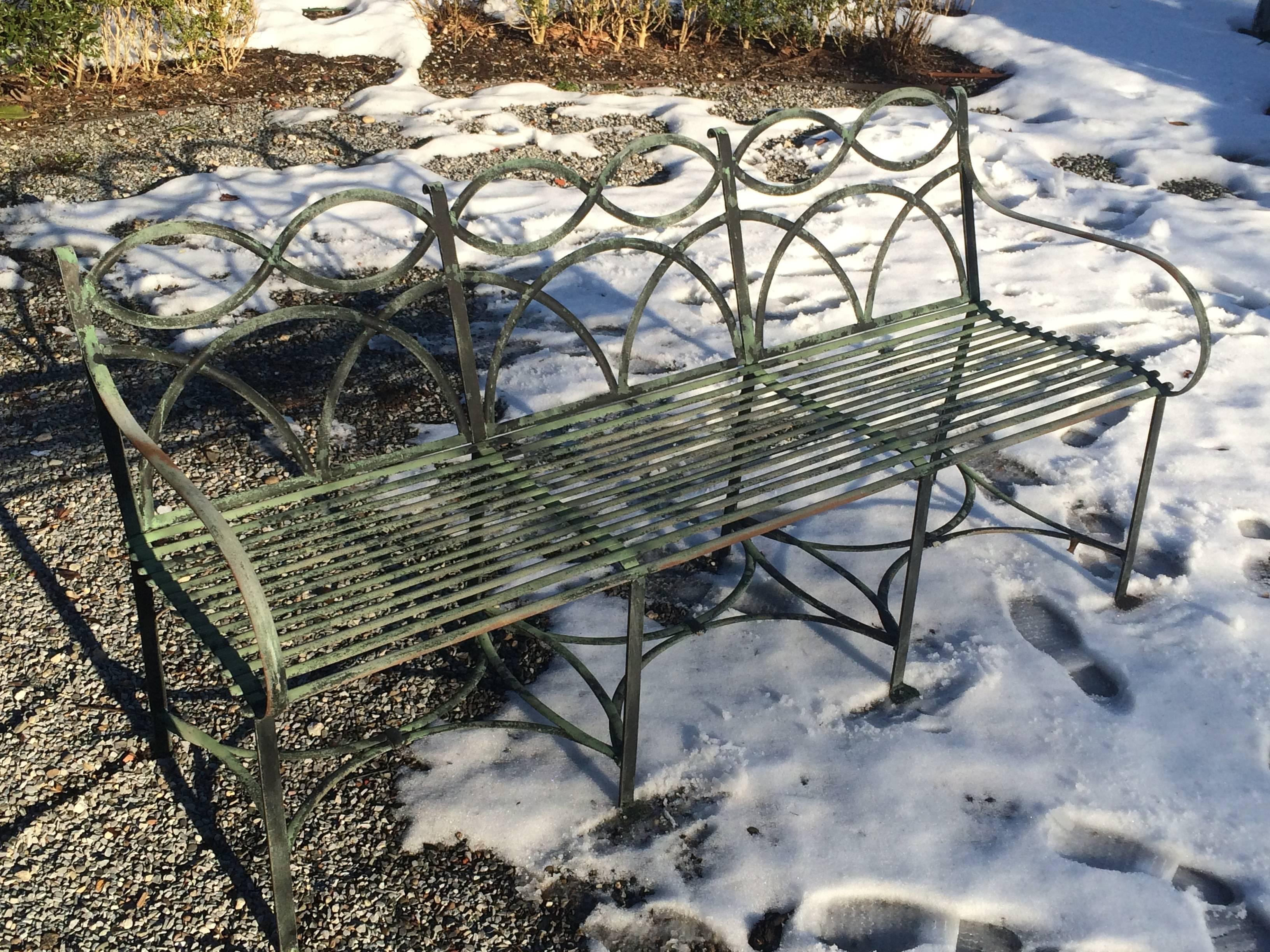 Pair of English Regency garden benches. Strapped metal, aged decorative paint finish.