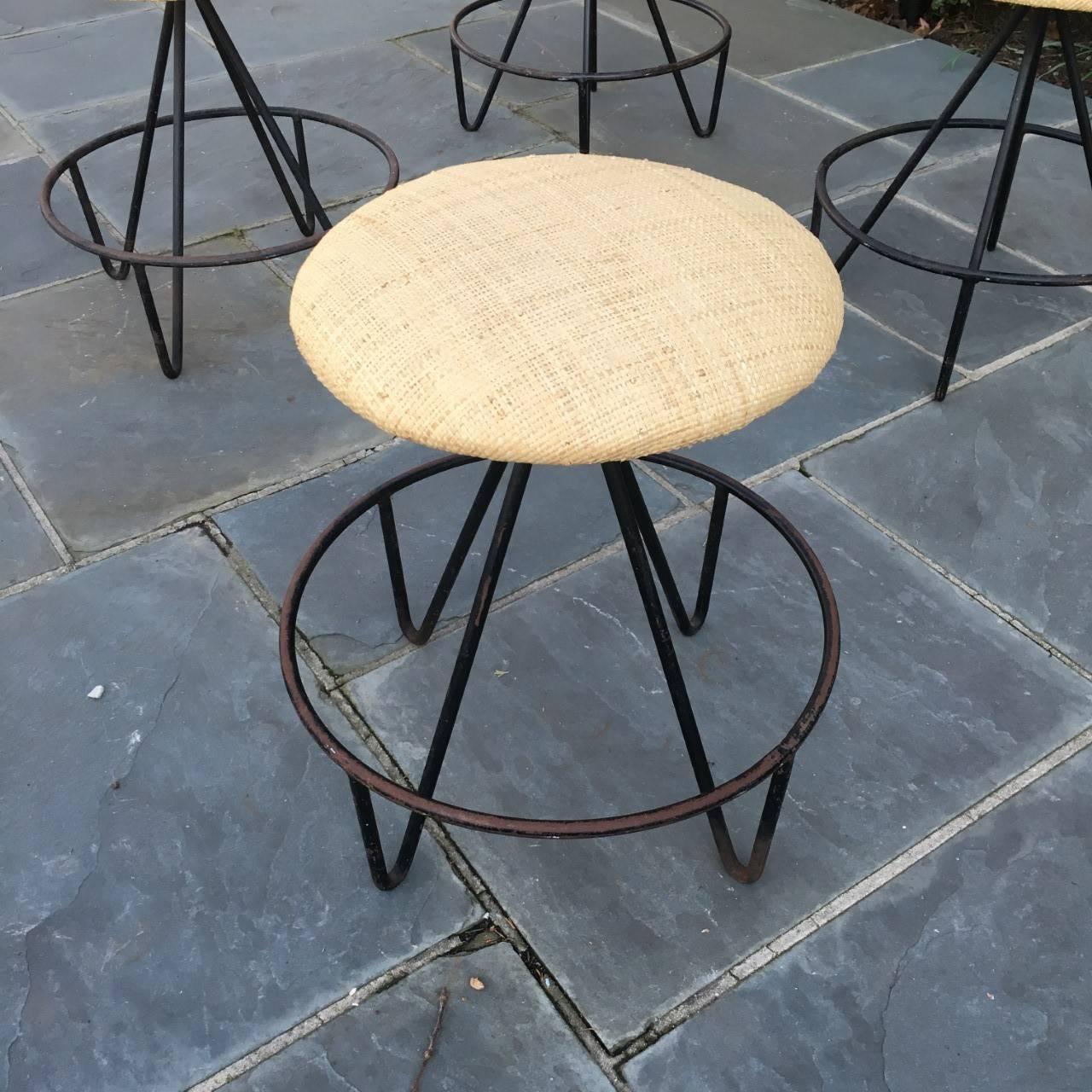 Set of four low iron stools- excellent for a bar counter or work area, USA, 1960s.