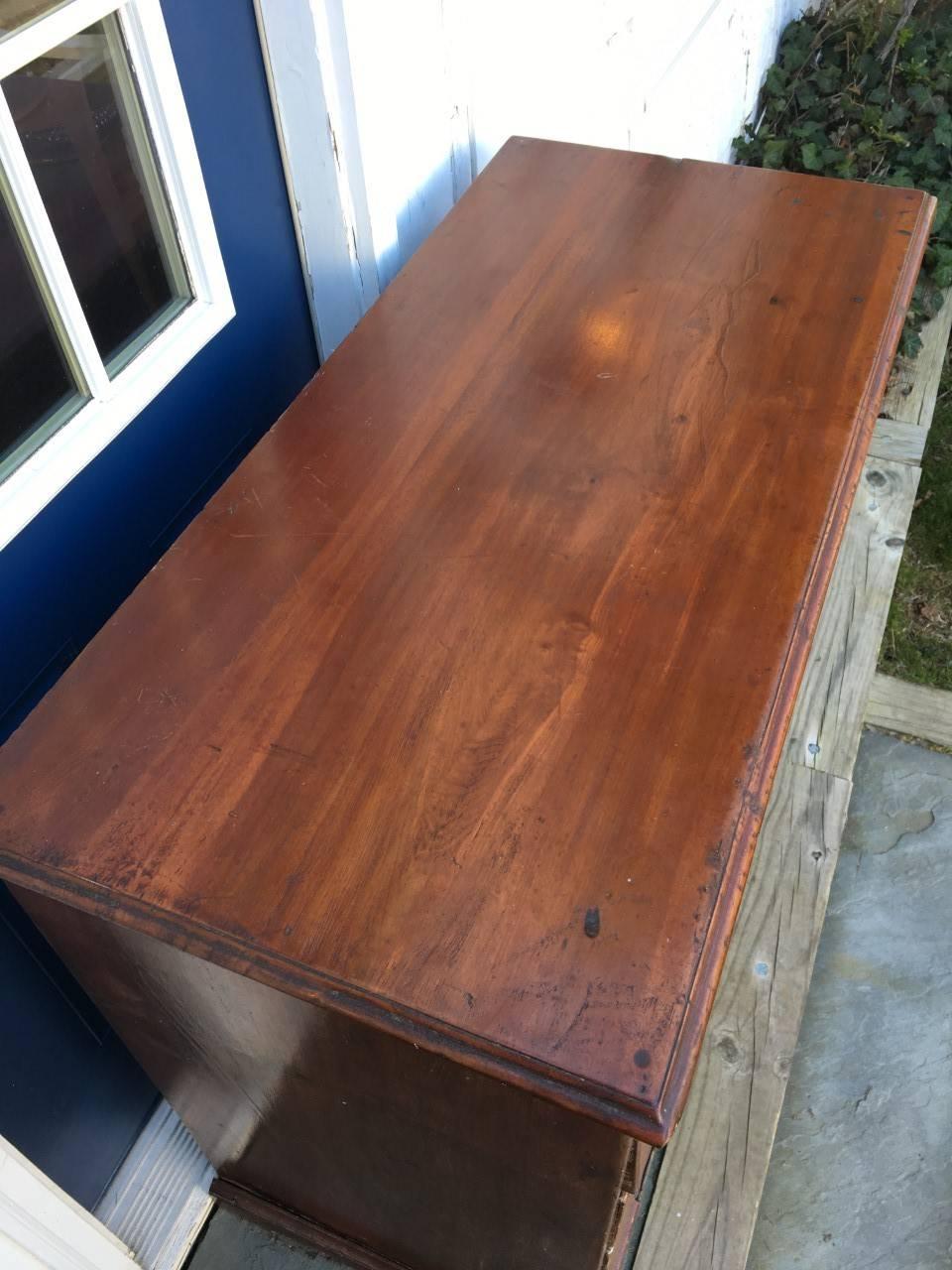 18th Century maple Chippendale graduated five-drawer chest on bracket feet.