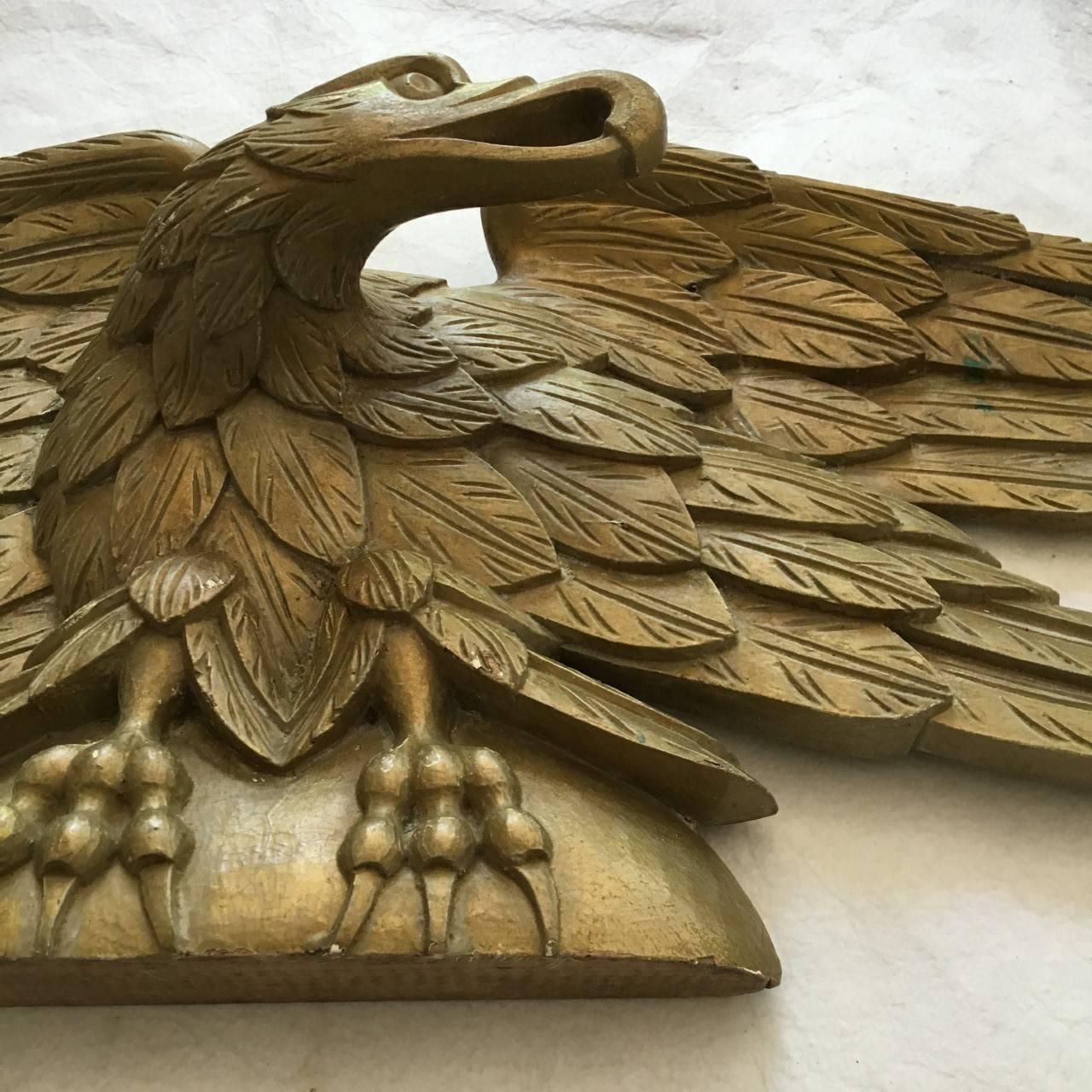 Craved gilt over-door eagle mount.
