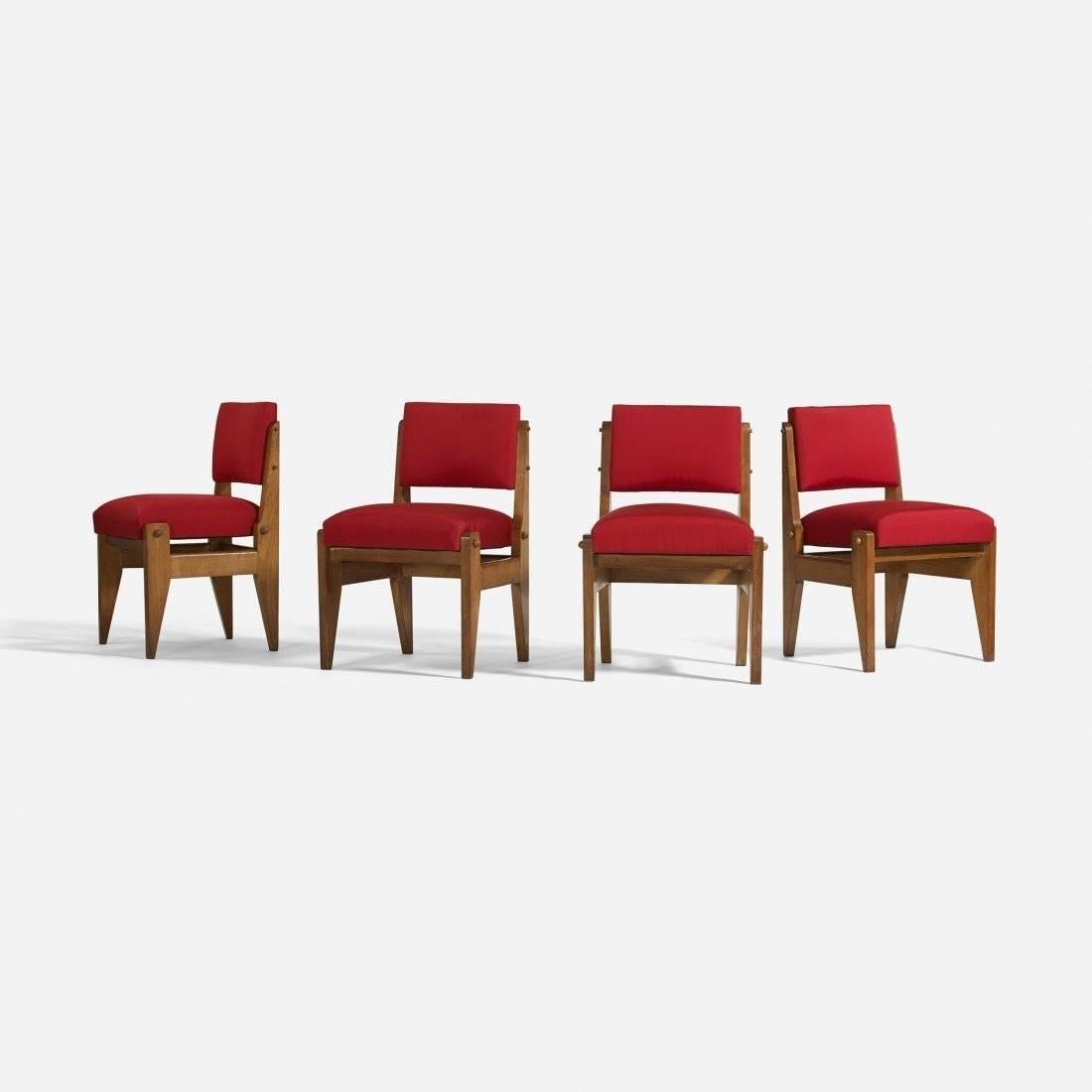 Set of four (4) rare side chairs designed by Robert Guillerme and Jacques Chambray; stained oak, upholstery; France, circa 1950.

