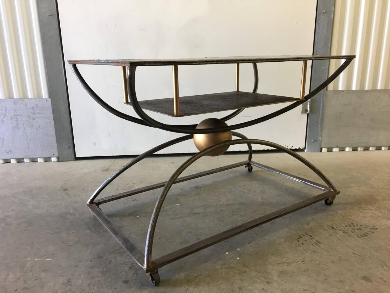 Postmodern artisan steel table/ entertainment unit on casters, 21st century.