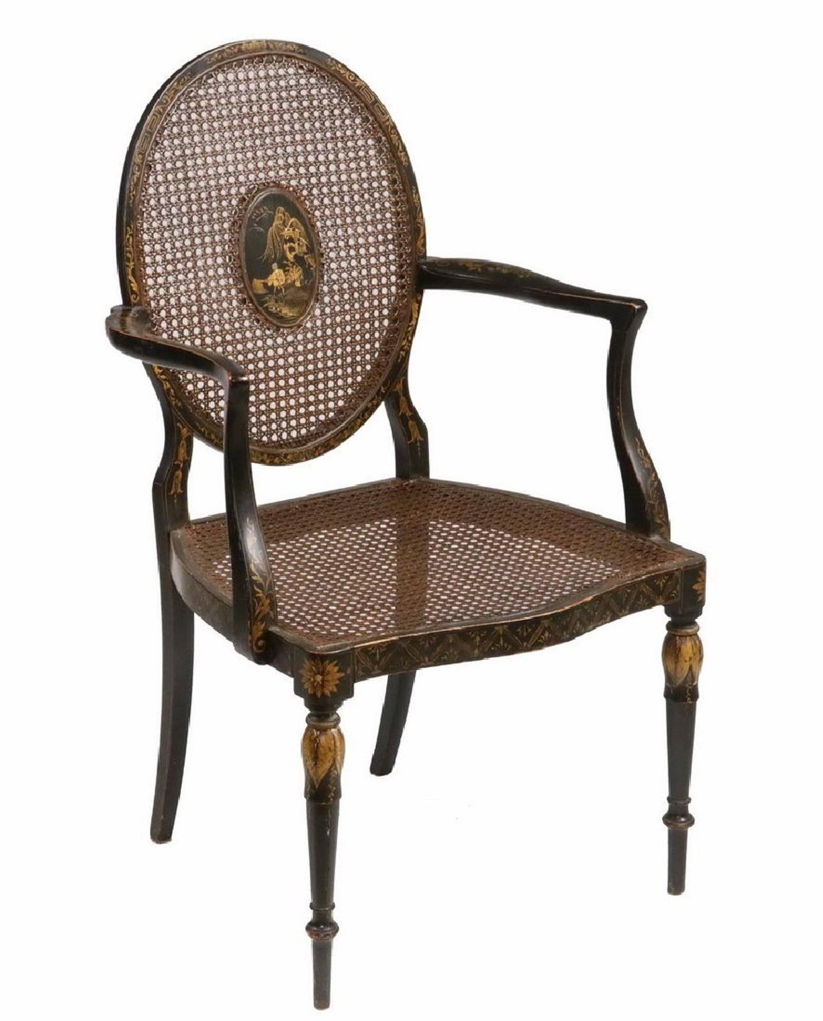 19th century English black lacquered chinoiserie armchair, caned seat and back, centre medallion.