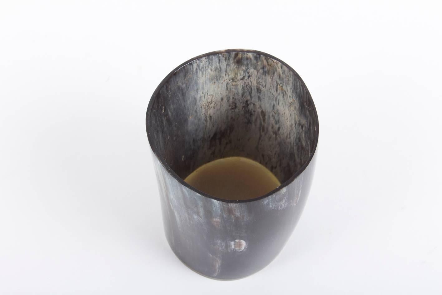 An incredibly well preserved horn cup by Auböck Vienna.
The base glued to the polished Horn.