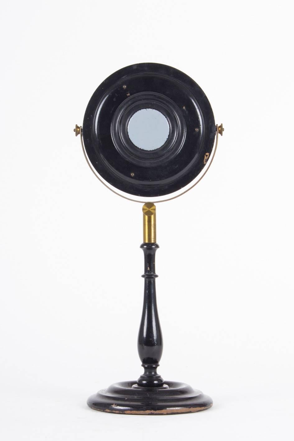 Mirrors like this were used for philosophical demonstration, mounted on ebonized wood stand with lacquered brass attachments.