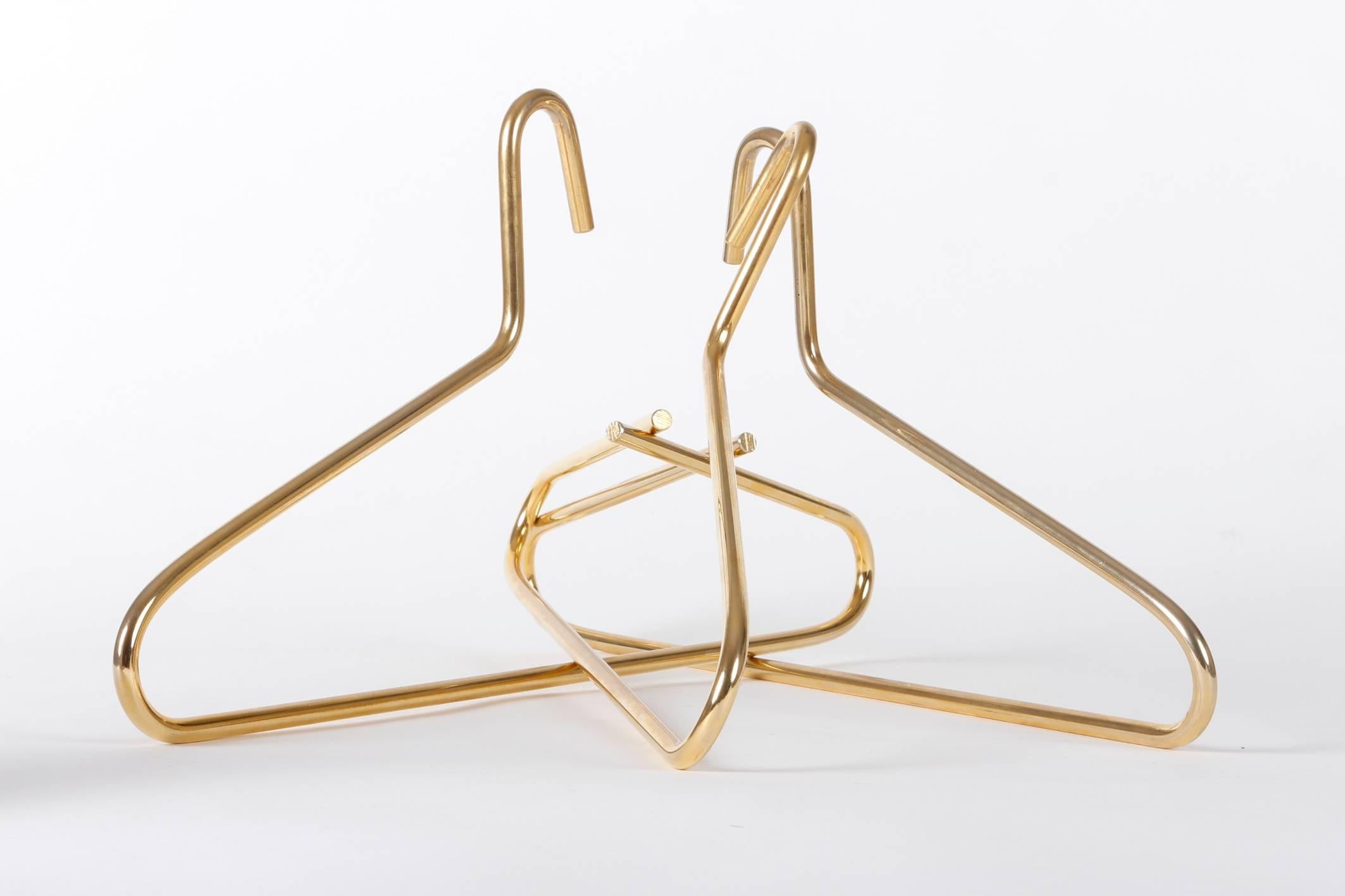Nice set of three brass-plated Auböck hangers.
   