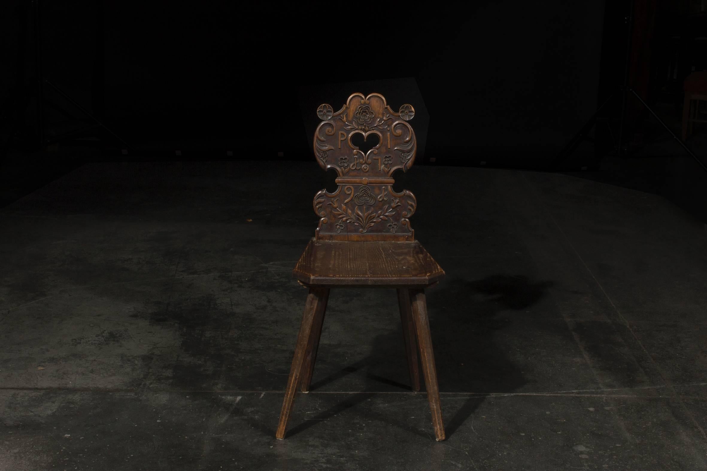 A late 18th century black forest carved wood chair. 
Dated on back 1791 and monogrammed 