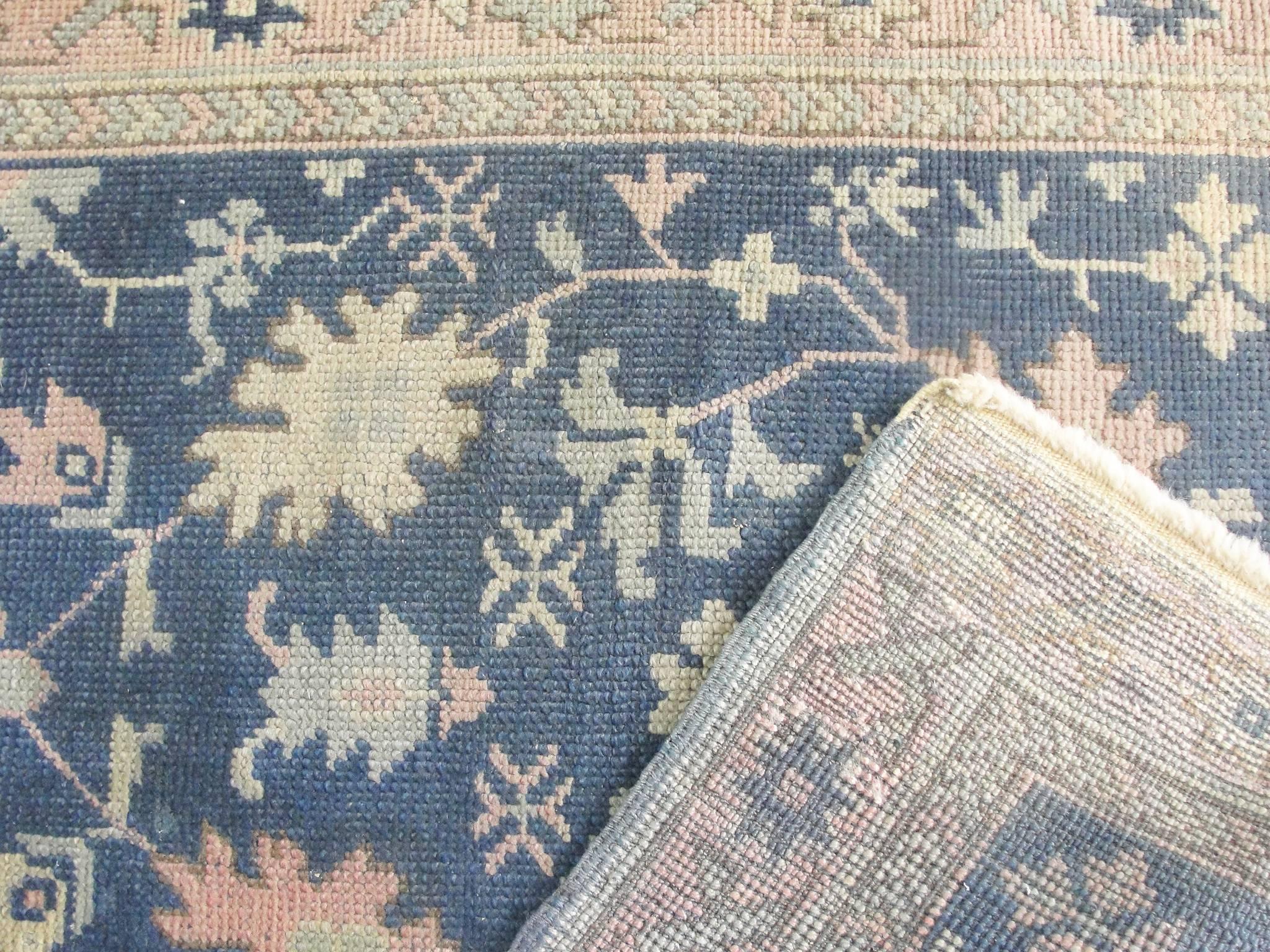 Size: 3'3" x 12'2" - 99 cm x 371 cm.
Origin: Western Anatolia.
Period: circa 1900.
Materials: Wool pile, wool warp and weft.
Condition: Very good.
Beautiful muted blue gray background color with large all over floral design. 
Ushak rugs