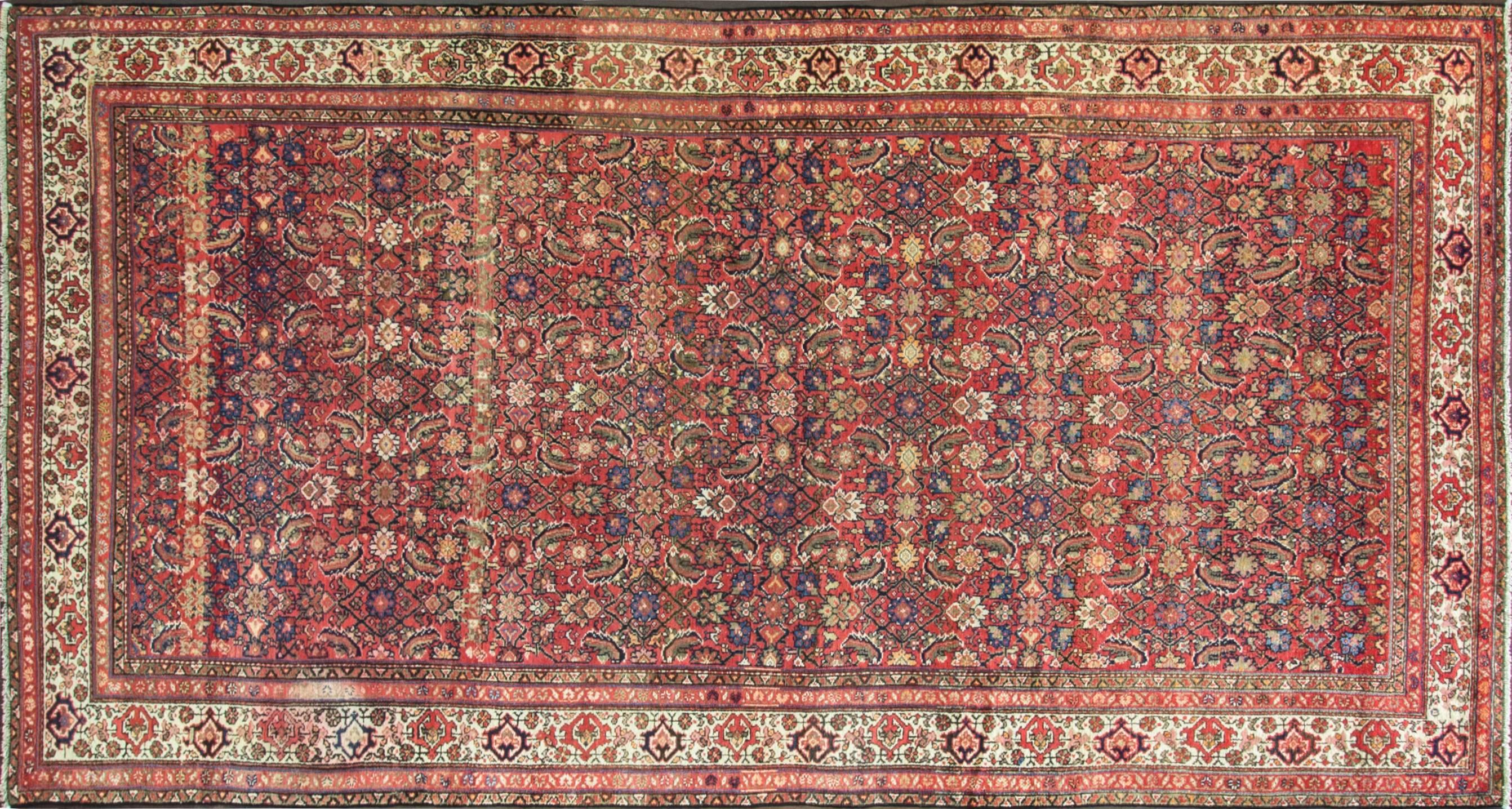 A very busy Herati center and a pleasant border design with running water and trees. The tribal weavers in Malayer were often Turkish, and they employed the Turkish knot, Gourde, to weave these creations. The Gourde is a symmetrical knot, as opposed