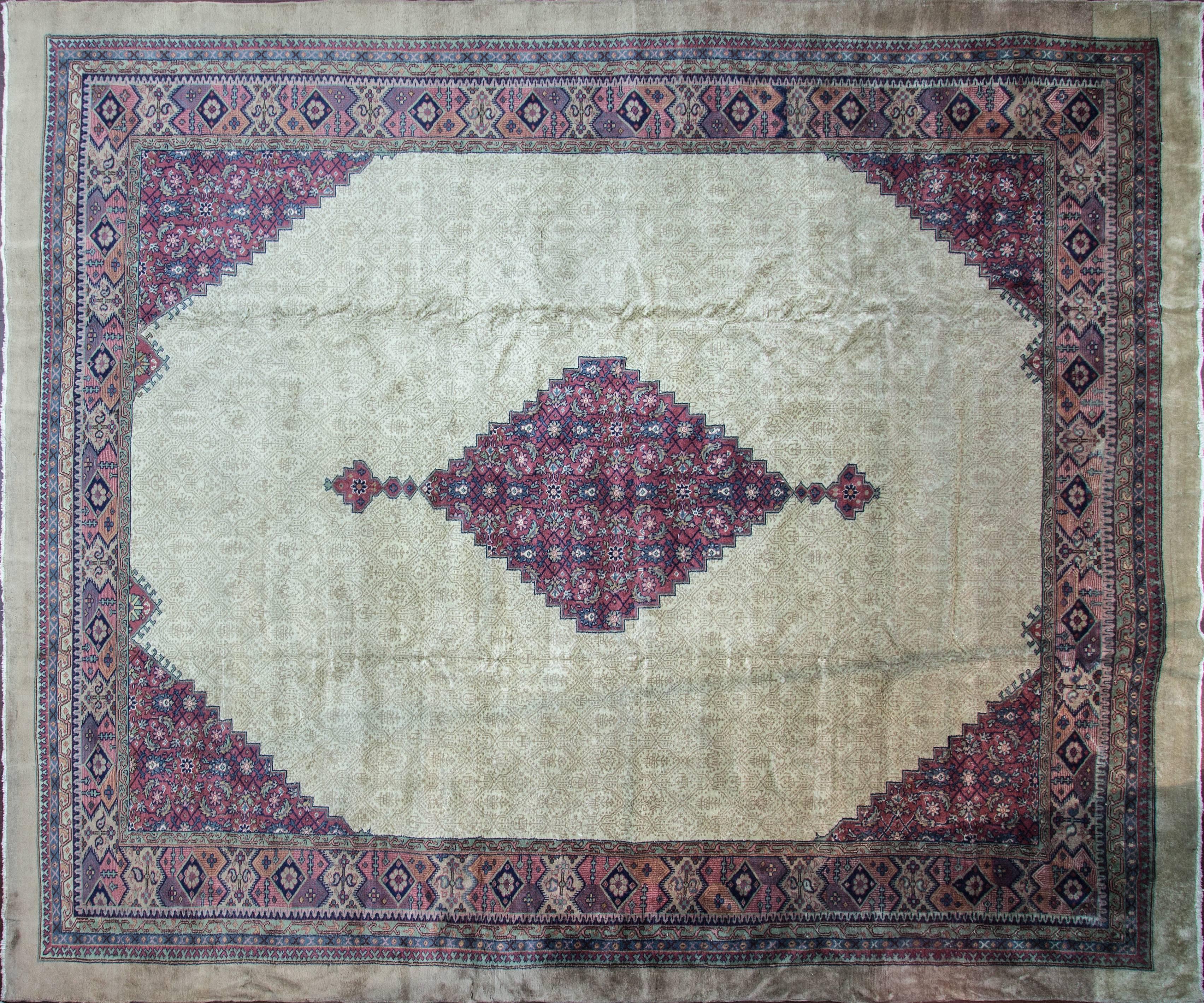 Antique Turkish Serab carpet. Measure: 12' x 14'.
Serab rugs are known mostly for their fine long rugs or runners and occasionally large room-sized rugs are also found with a characteristic camel ground and lozenge-shaped medallions, camel-colored