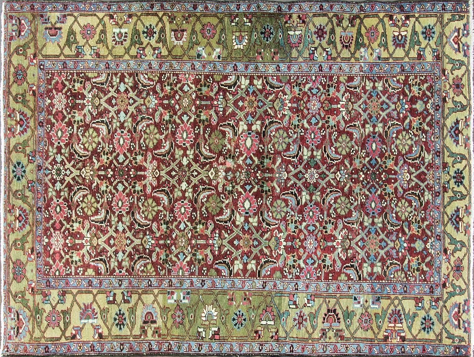 Unusual beautiful and colorful Persian Heriz rug, circa 1900, with vegetable dyes and abrash. Heriz rugs are Persian rugs from the area of Heris, East Azerbaijan in northwest Iran, northeast of Tabriz. Such rugs are produced in the village of the
