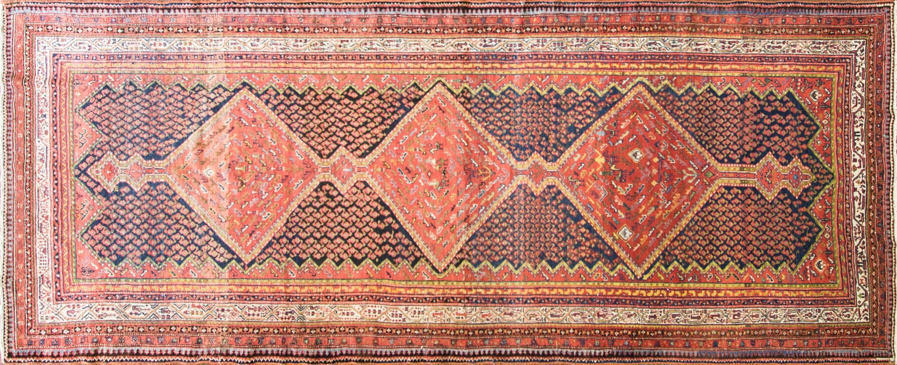 A very busy Herati center and a pleasant border design with running water and trees people and animals. The tribal weavers in Malayer were often Turkish, and they employed the Turkish knot, Gourde, to weave these creations. The Gourde is a