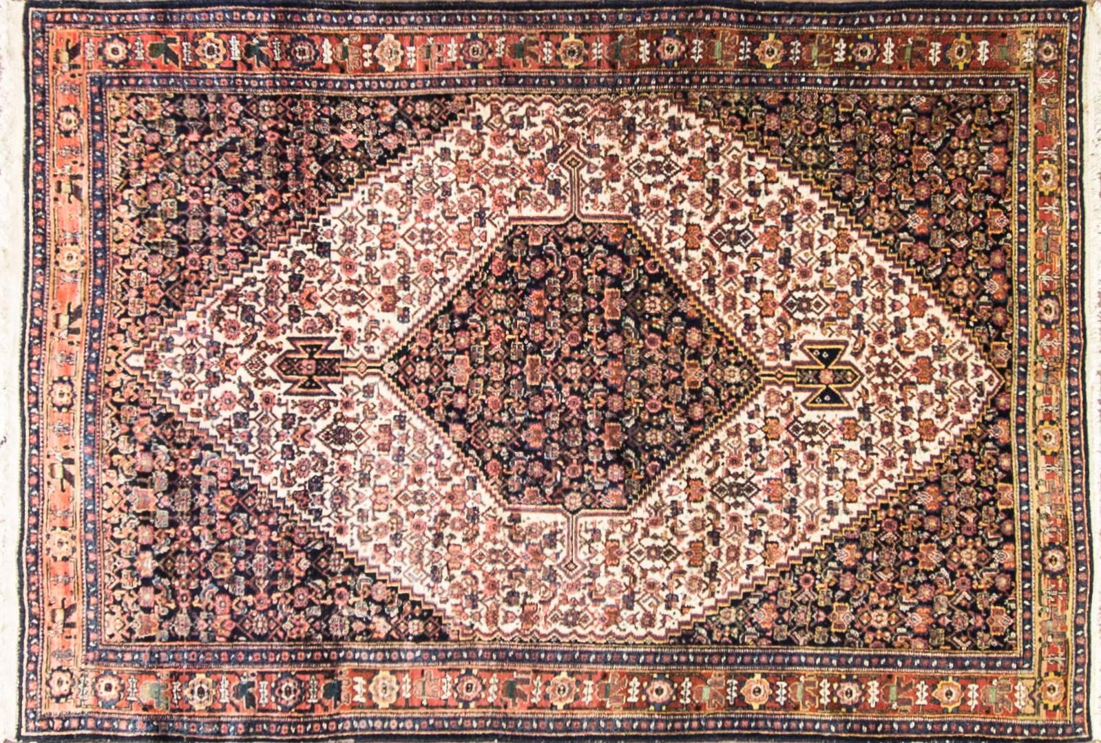  Persian Senneh Rug
The province of Kurdistan is situated in the western part of Iran. Its capital today is Sanandaj, but in the context of carpets, the older name, Senneh, is still used. Around the province the Kurdish people weave strong, durable
