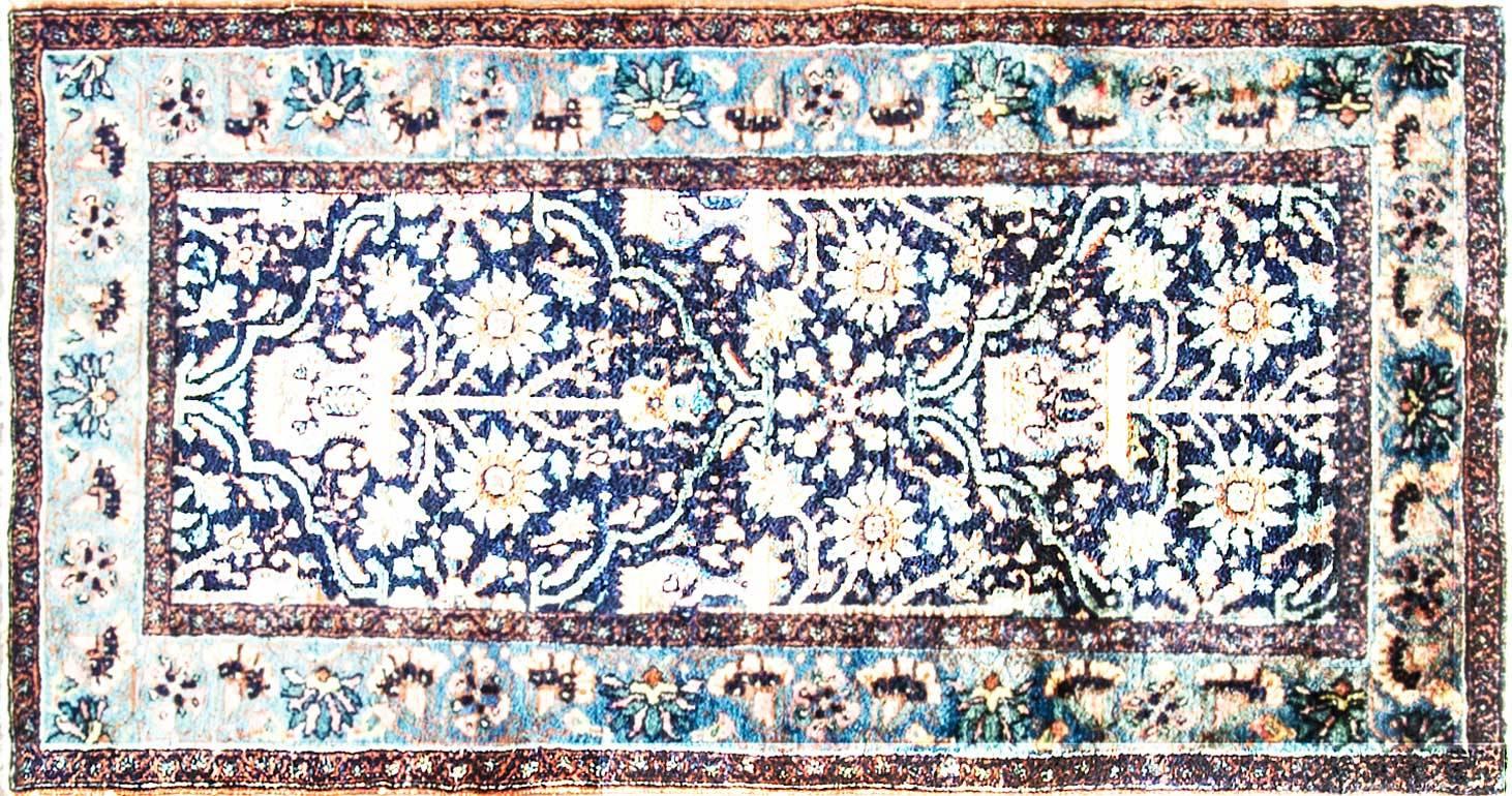 Persian rug with even high pile throughout, circa 1920. Features traditional 16th century Persian floral vase motif in blue, green, and salmon pink. Measures: 3'3