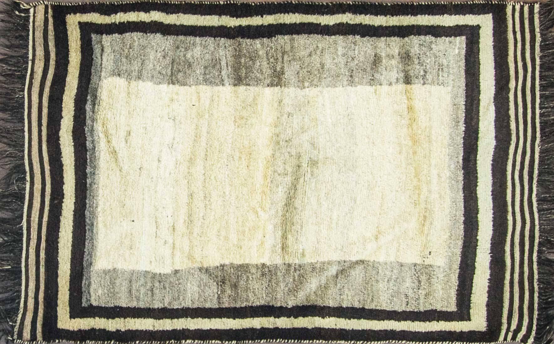The rich silky wool and the minimal designs have inspired countless rug lovers. The late 19th century gabbeh rugs were woven by tribal weavers who live in the majestic Zagros Mountains. This mountain range (the largest in Iran) rises up to nearly