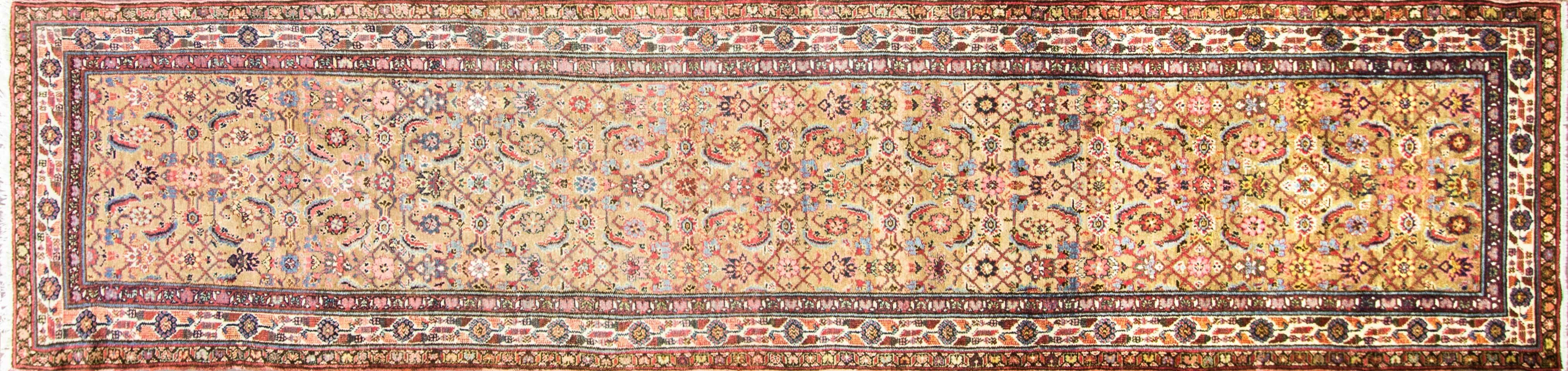 A pleasant Botheh design with an ivory color border. The tribal weavers in Malayer were often Turkish and they employed the Turkish knot, Gourde, to weave these creations. The Gourde is a symmetrical knot, as opposed to the asymmetrical knot of many