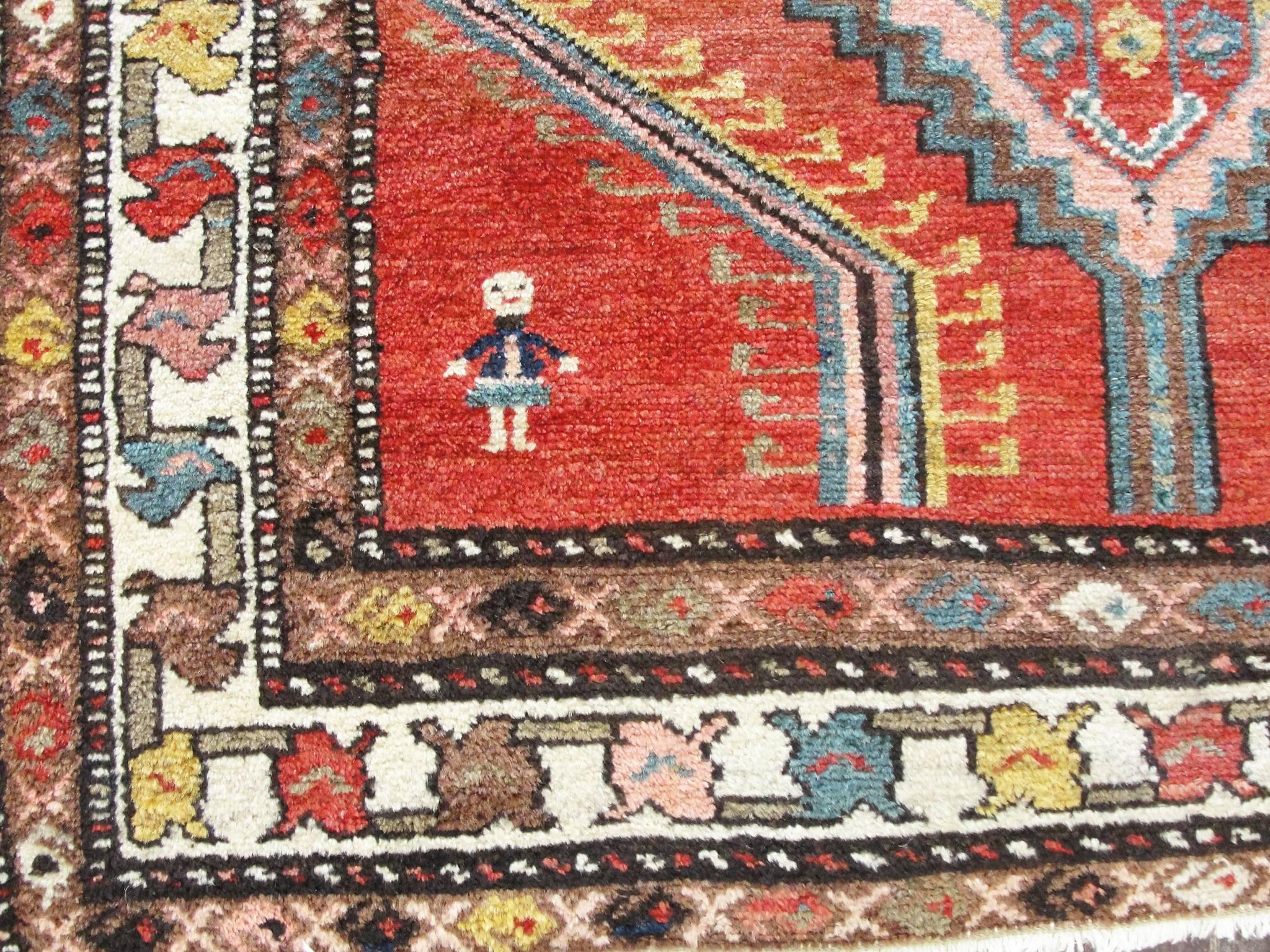 A great sample of antique Kurdish tribal runner. Showing a man and woman probably the husband and wife the villagers.
This rug made in north-western Persia in the Kurdish village and the pattern is geometric consists of a rosette enclosed in a