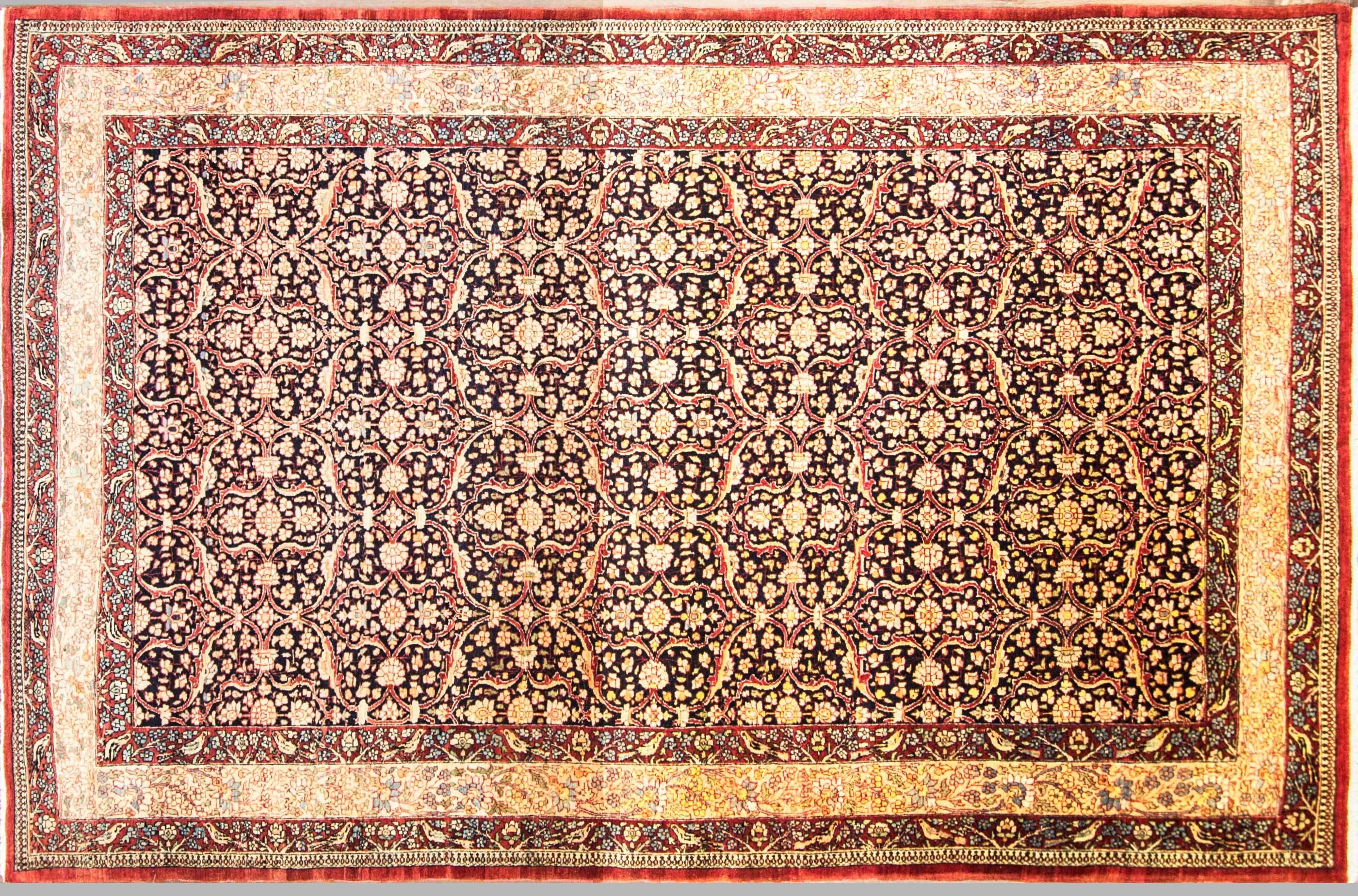 Antique Tehran carpet, country of origin: Persia, circa date: 1900. Minuscule details are gorgeously presented throughout the Tehran carpet to create a vivacious tapestry of floral elements and dancing petals. Several borders frame around each other