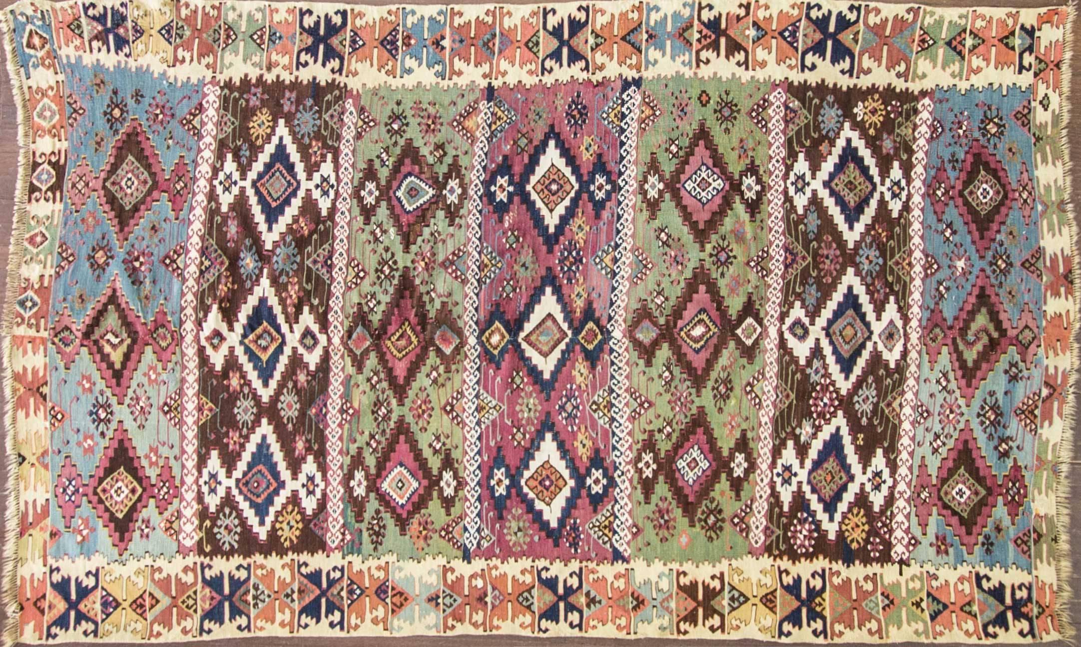 Turkish Kilim, circa 1880

It is from the group of Konya called Nigde-Adana.
It has geometric pattern both in the field and the border.
This Kilim made of two sections.
One of oldest that I have seen according the colors.


 