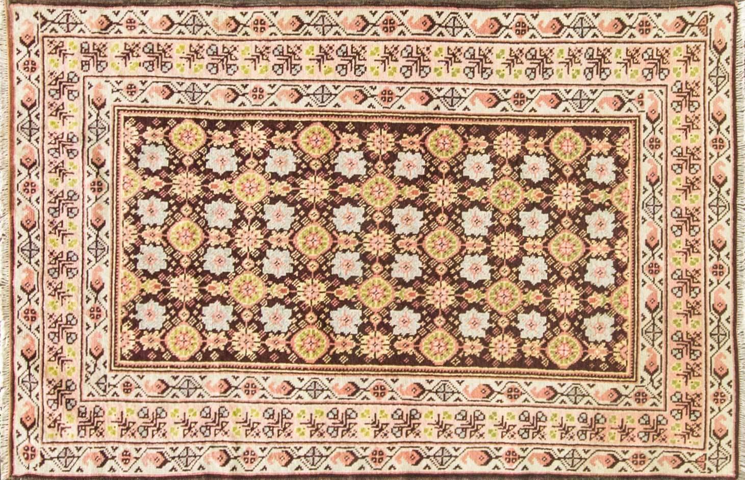 A very decorative rug.
The Romanian Oltenia rugs were produced in the Southern Romanian province of Oltenia, these vibrant rugs are known for using predominantly strong colors such as red and blacks against green or sandy-colored backgrounds.

The