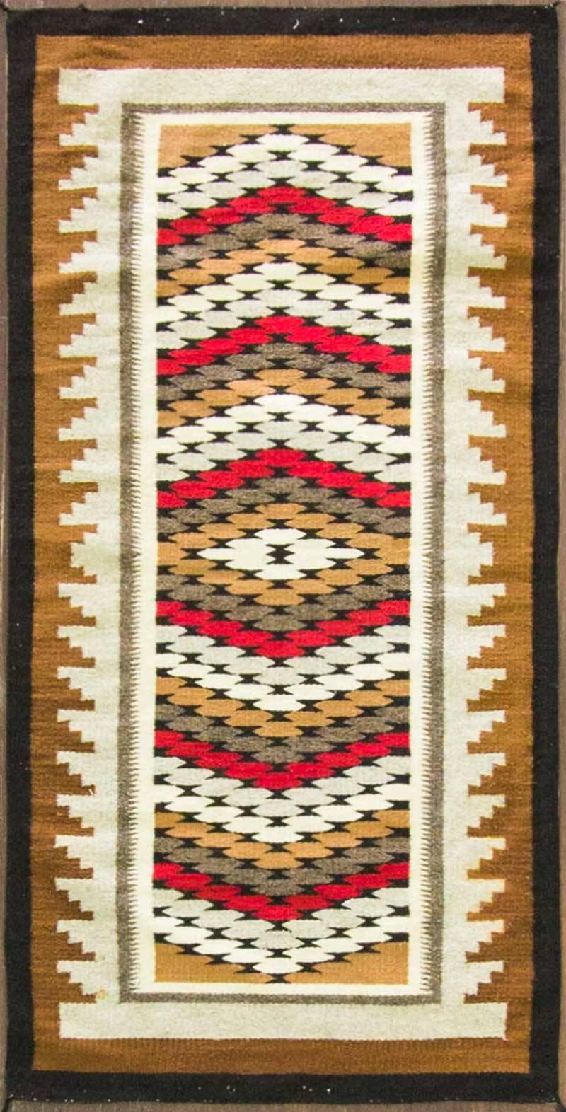 The weavers preferred to use natural wool from their sheep rather than the commercially produced wool used by other Navajo weavers. After the wool was carded together it was spun very fine, sometimes even as fine as thread. These threads allowed the