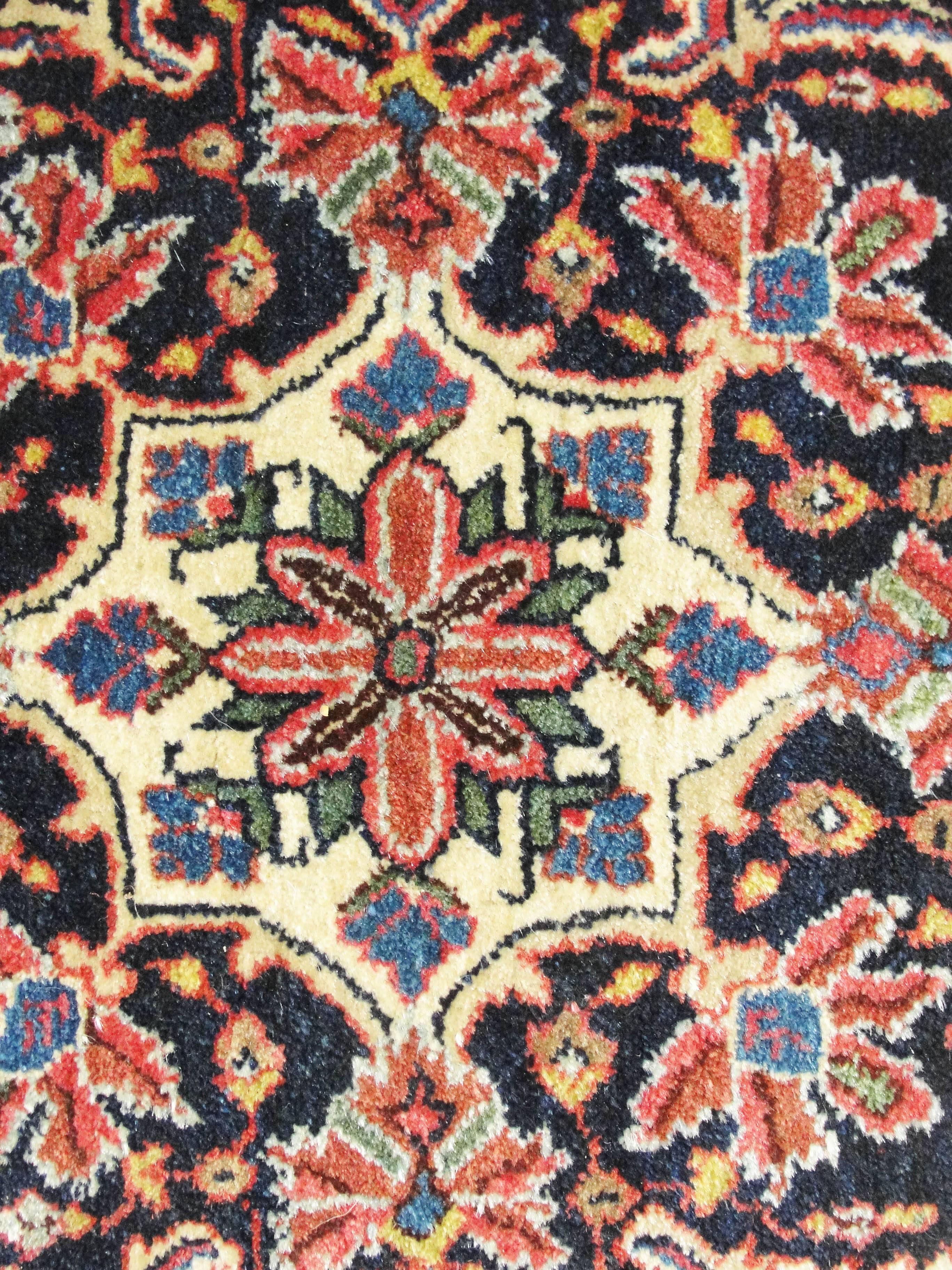 Immerse yourself in the captivating world of our Antique Persian Bijar Rug, a true masterpiece measuring 4'4