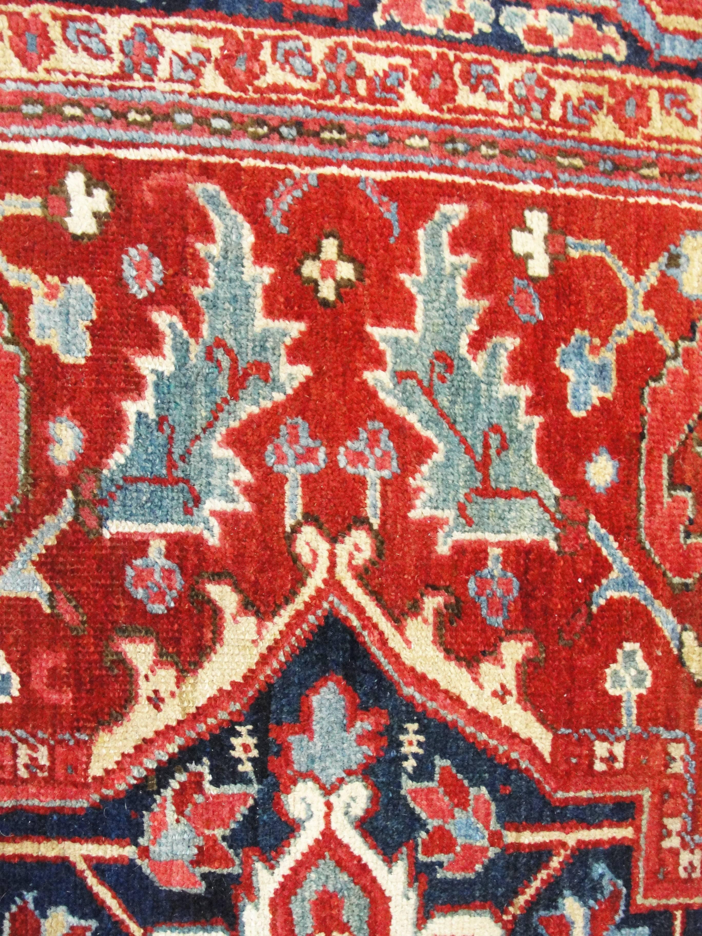 A charming antique Persian Heriz carpet it has a range of outstanding colors. A great painting is measure by beauty of its colors and the same statement goes for this rug. Heriz rugs are Persian rugs from the area of Heriz, East Azerbaijan in
