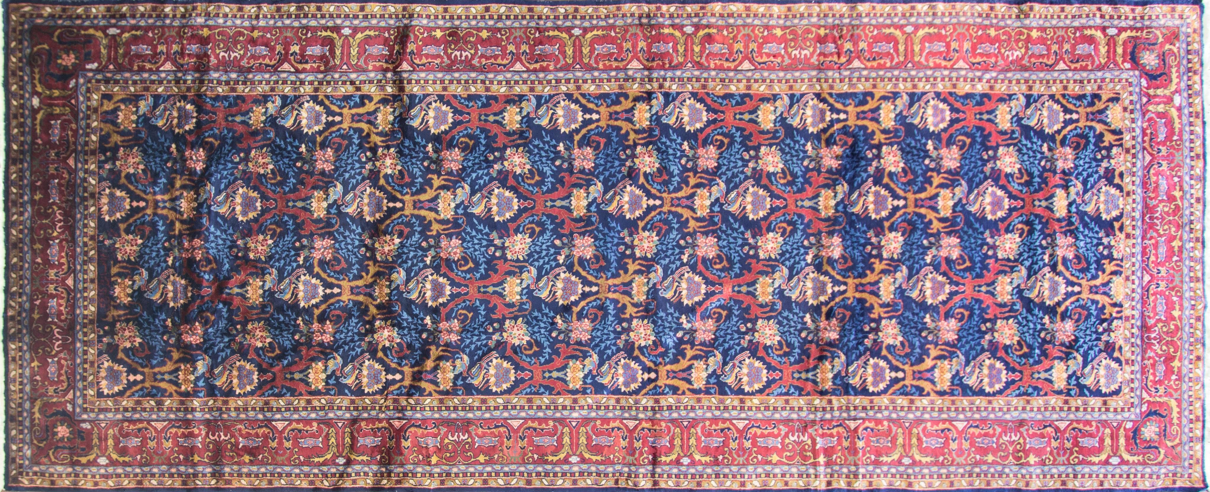 Agra gallery size carpet, birds in love in excellent condition, reduced in size, circa 1920.
Agra is a large city and weaving district in North Central India that has been prolific in producing tightly knotted, decorative, floral rugs. Antique Agra