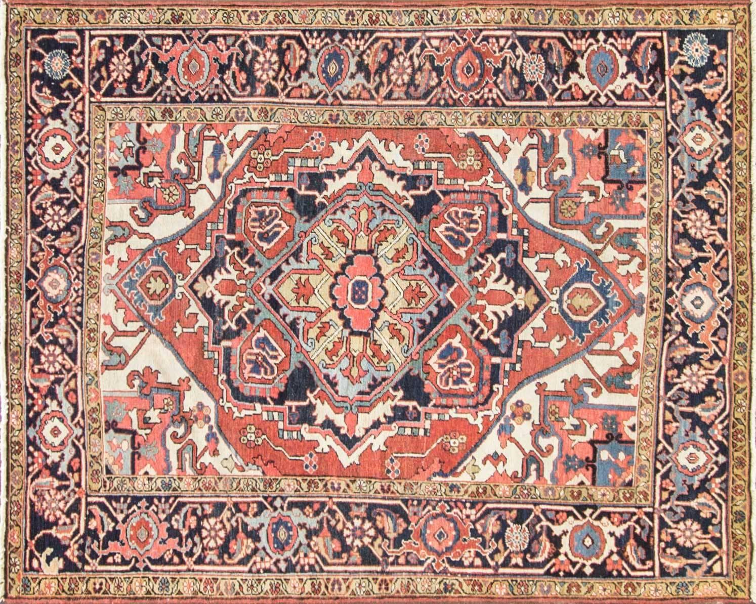 Exquisite and timeless, this Antique Persian Serapi rug, circa 1900, measures 4'11