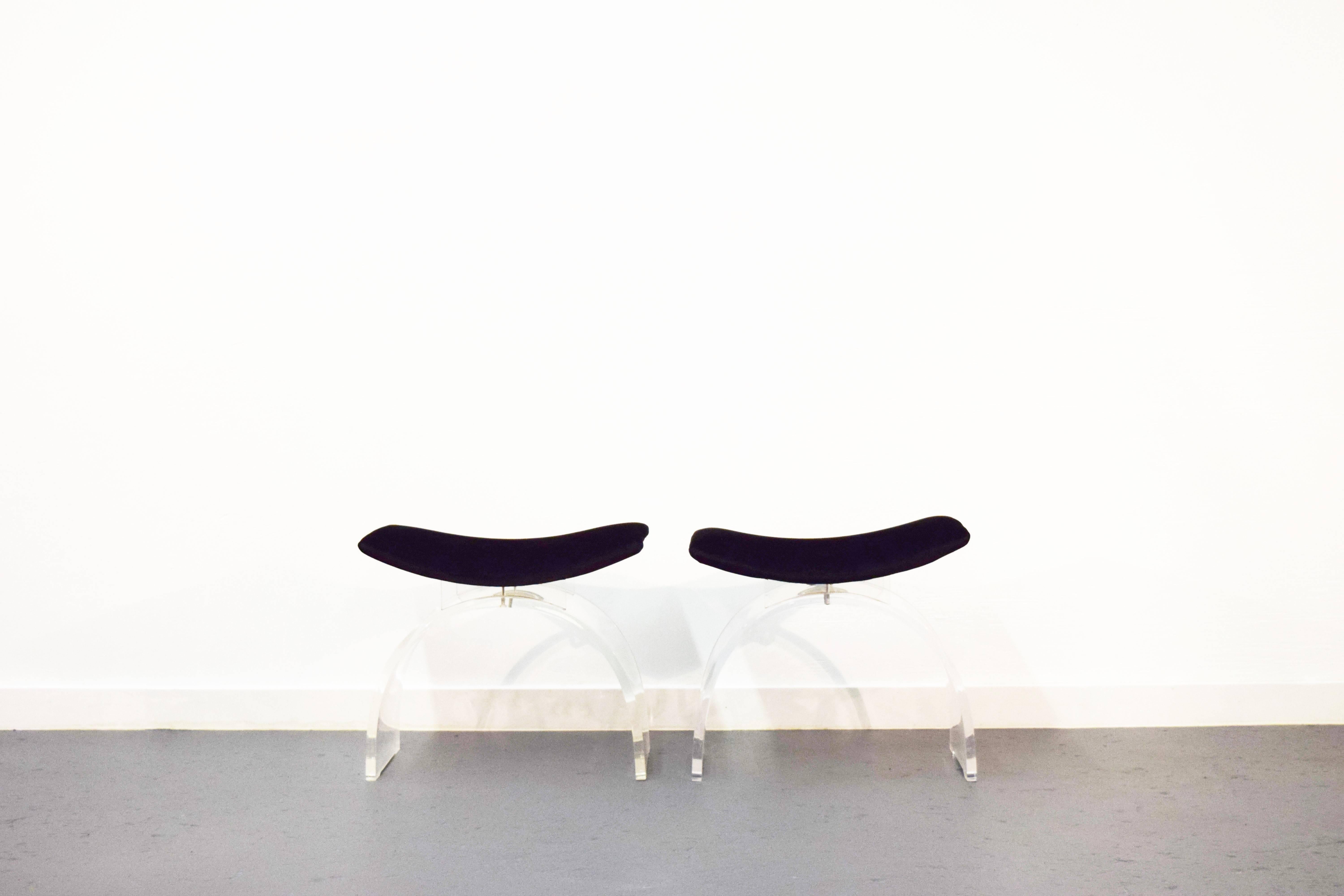 Pair of curved Lucite stools. Stools have been reupholstered in black velvet.