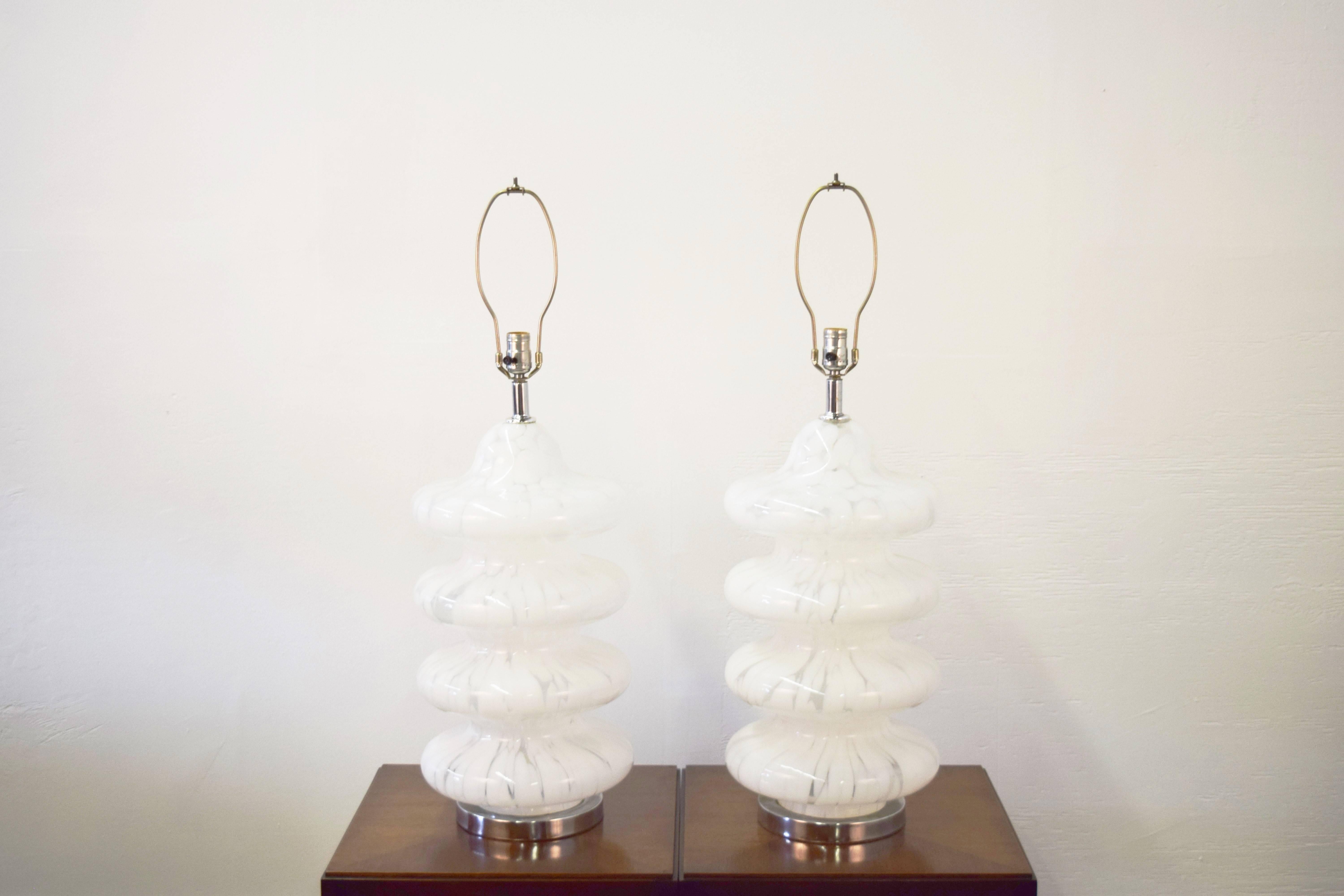 Pair of four-tiered Murano table lamp. Lamps sit on chrome bases.