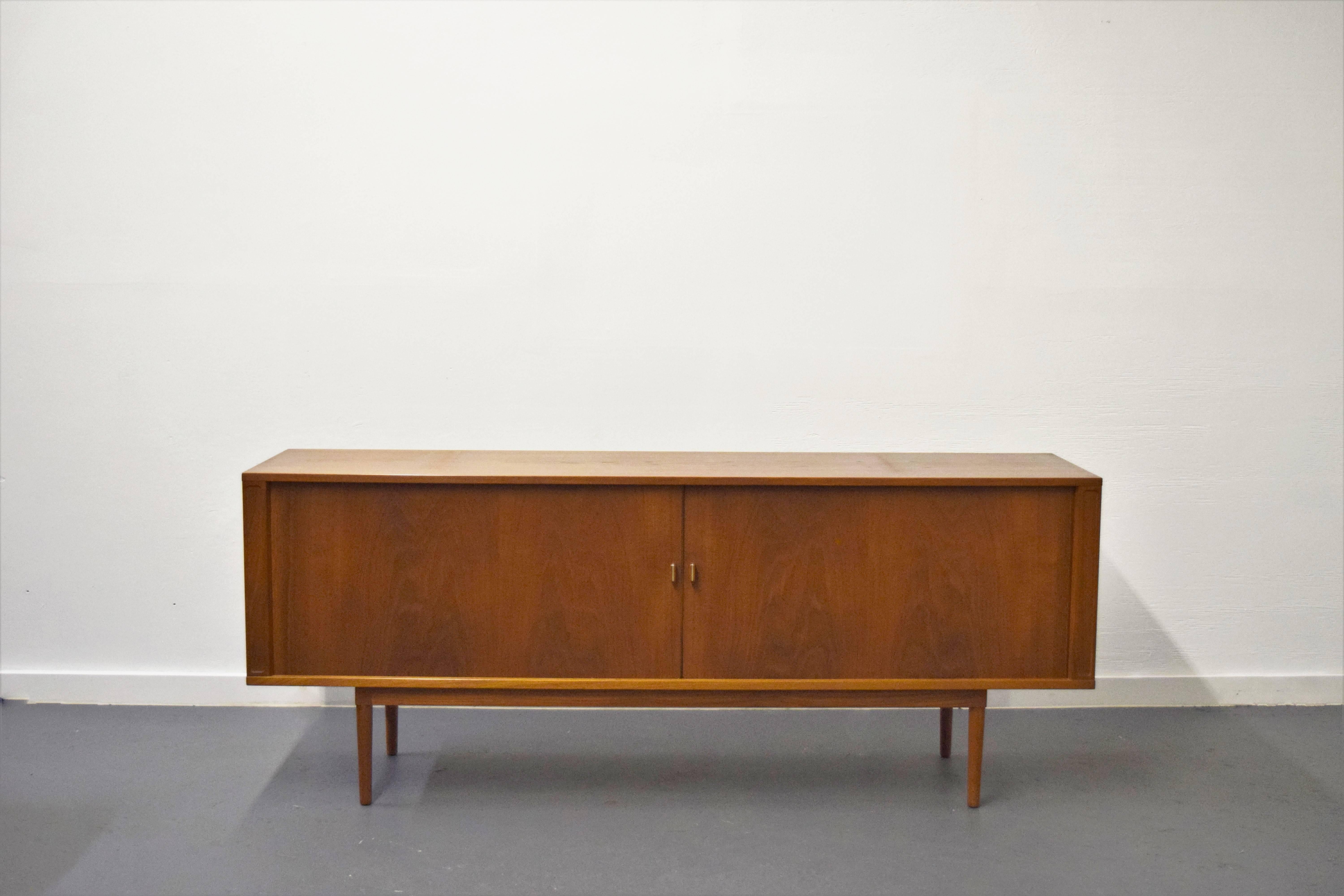 Jens H. Quistgaard tambour door credenza. Top hutch included. Height of credenza with hutch 58.25.