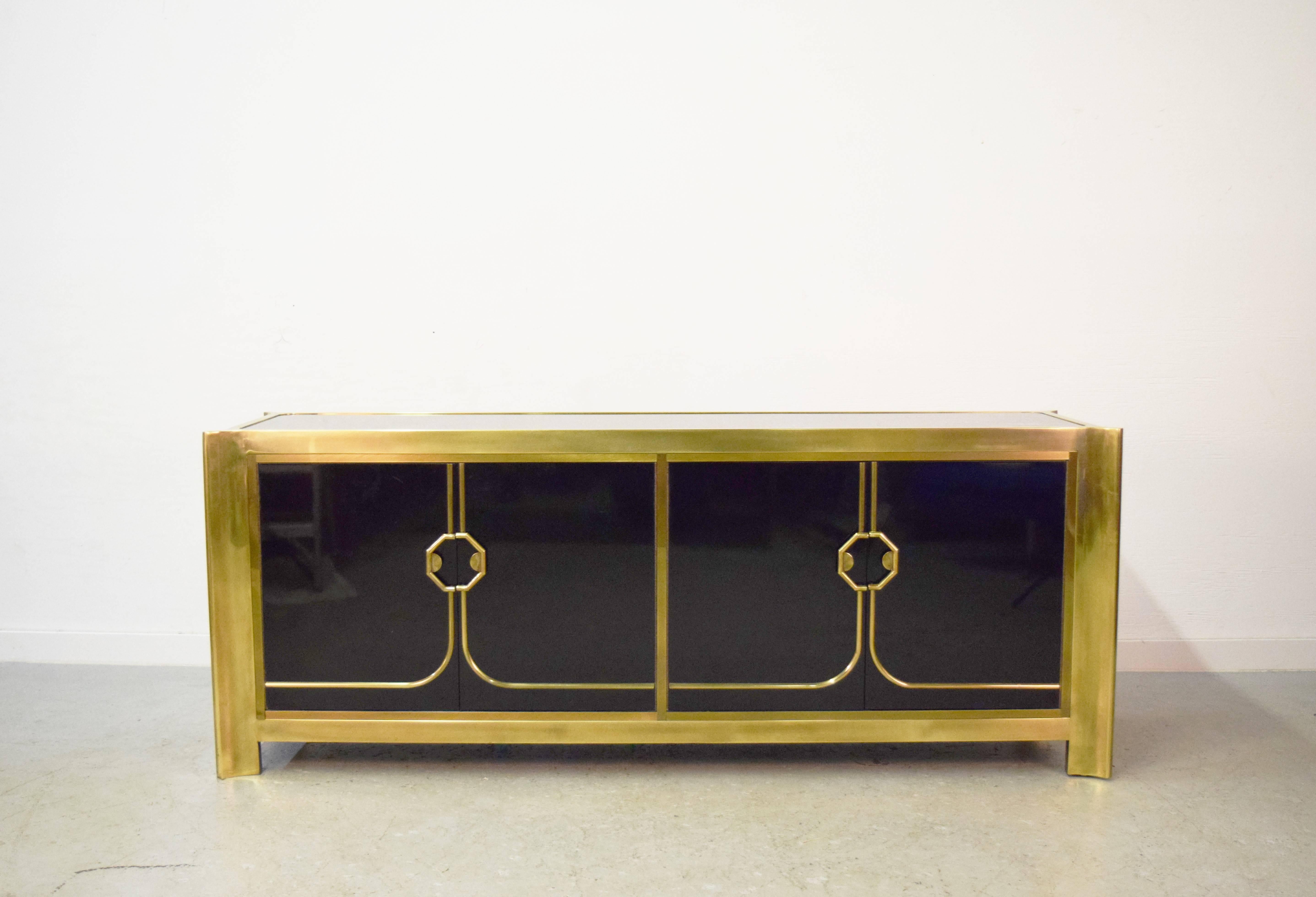 Black lacquered and brass credenza by Mastercraft.