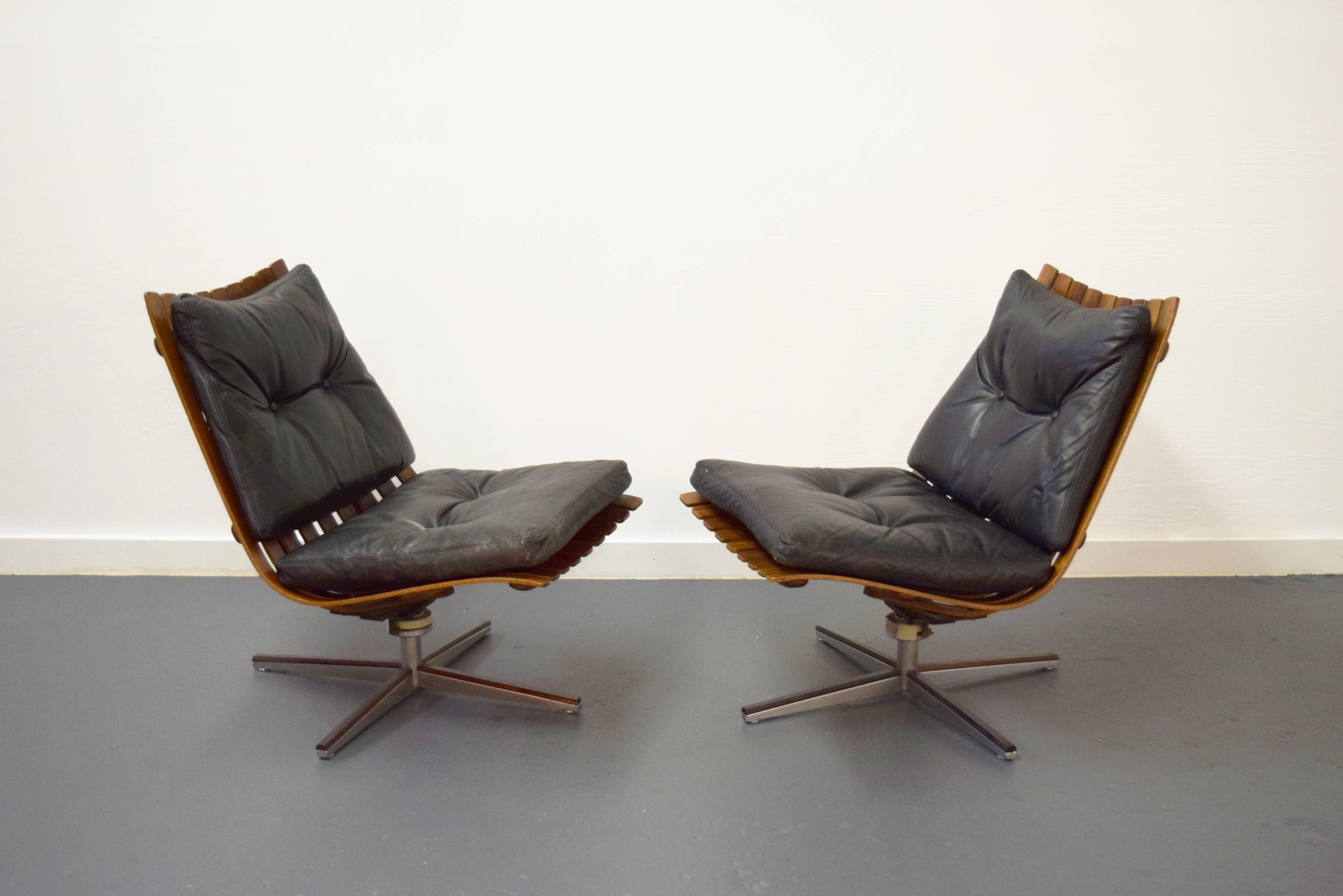 Mid-Century Modern Pair of Hans Brattrud Rosewood Swivel Lounge Chairs