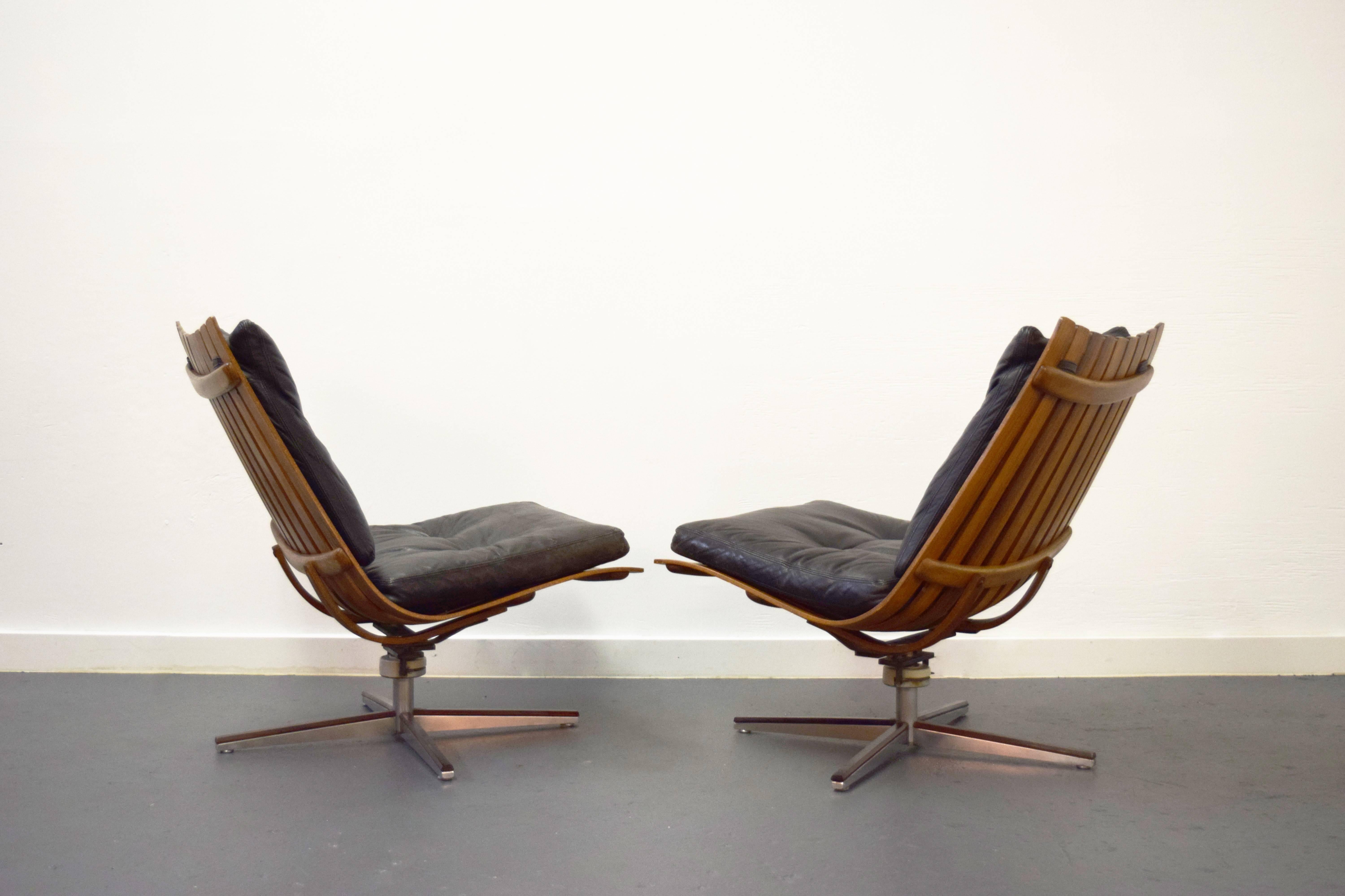 Norwegian Pair of Hans Brattrud Rosewood Swivel Lounge Chairs