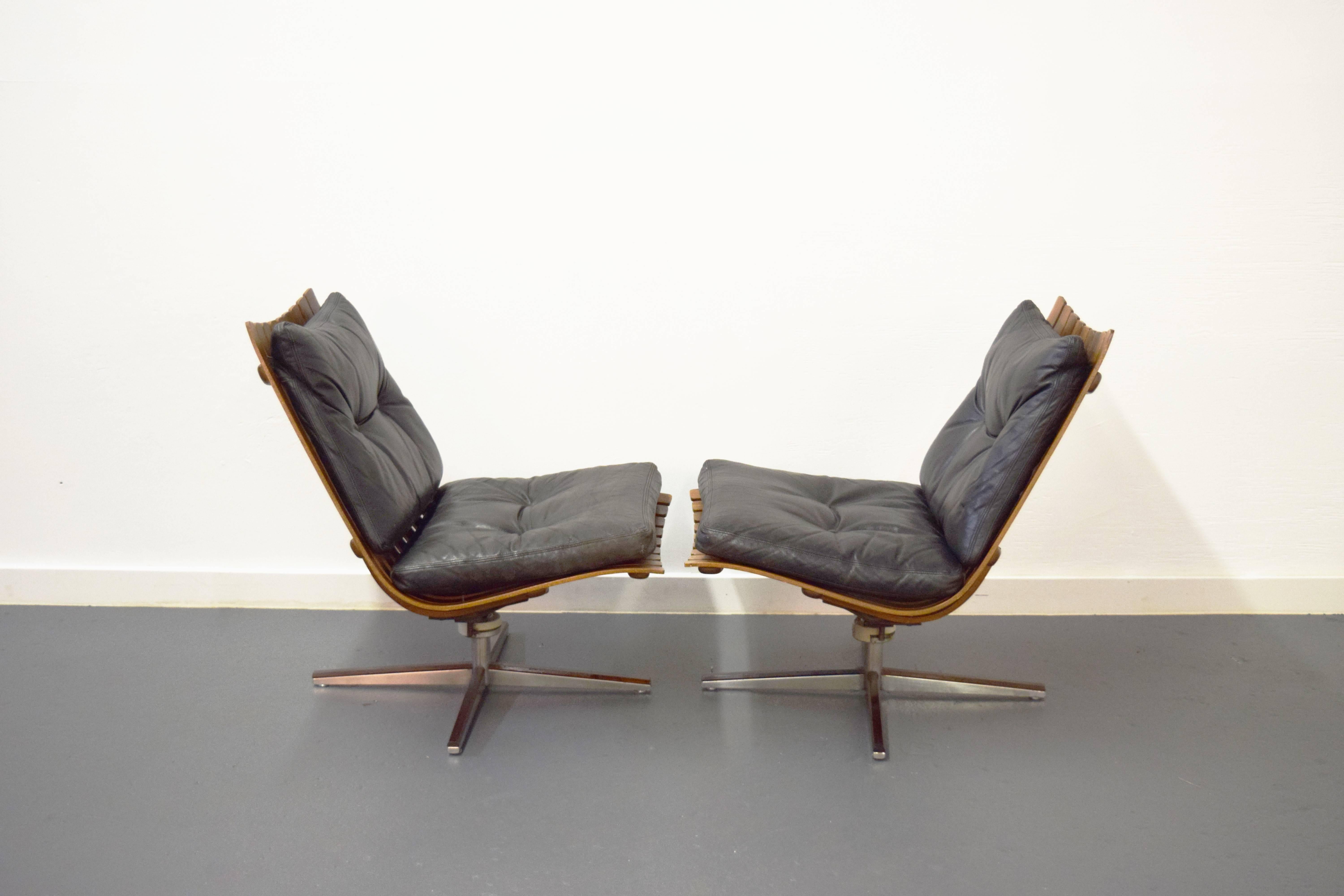 20th Century Pair of Hans Brattrud Rosewood Swivel Lounge Chairs