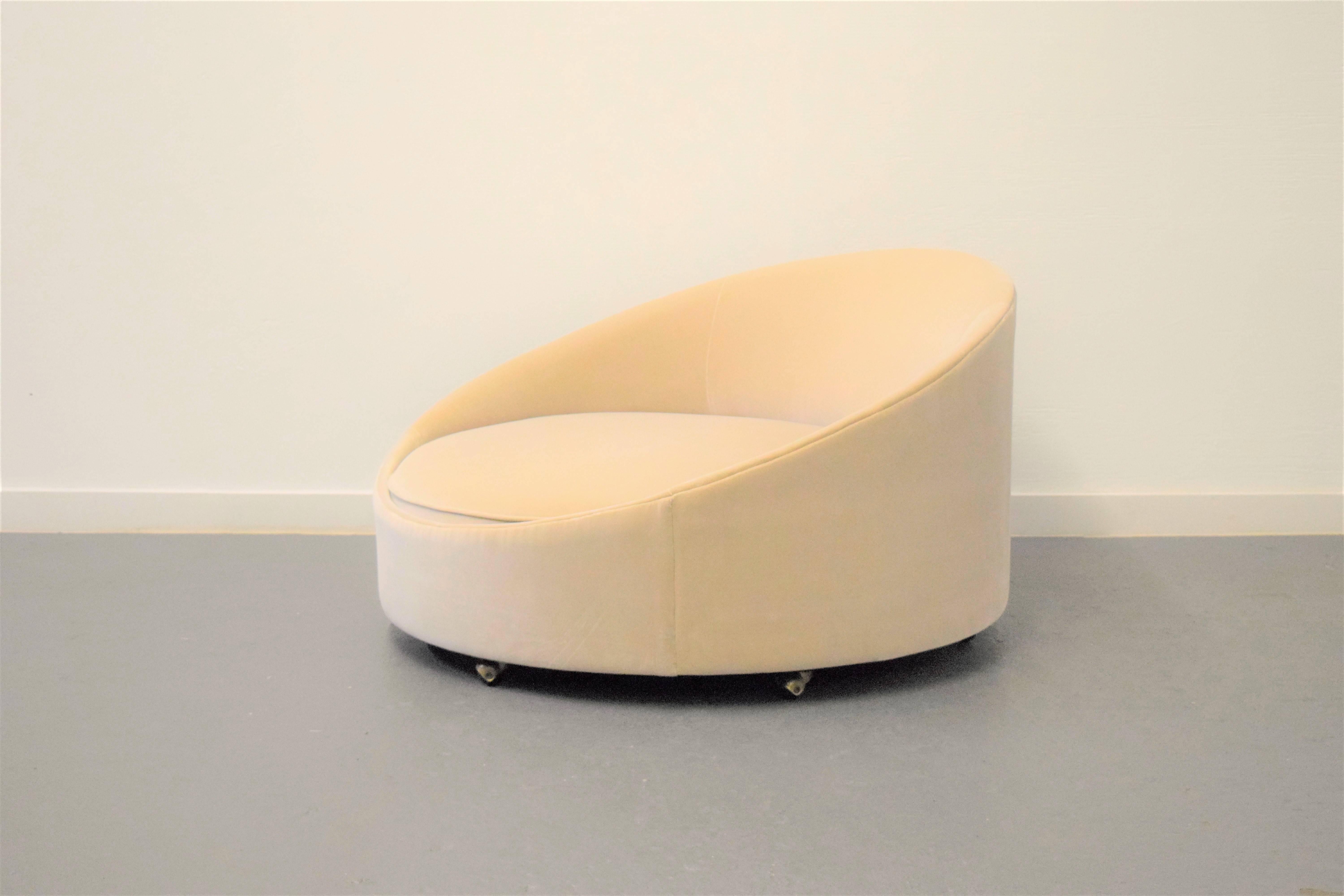 Large Adrian Pearsall lounge chair. Reupholstered in a soft cream velvet. Lounge chair sits on wheels.